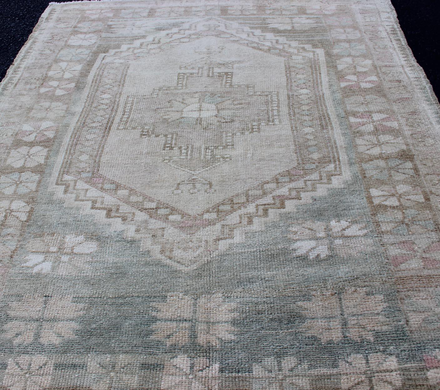 Wool Vintage Turkish Oushak Rug with Stylized Medallion in Soft Green and Creams