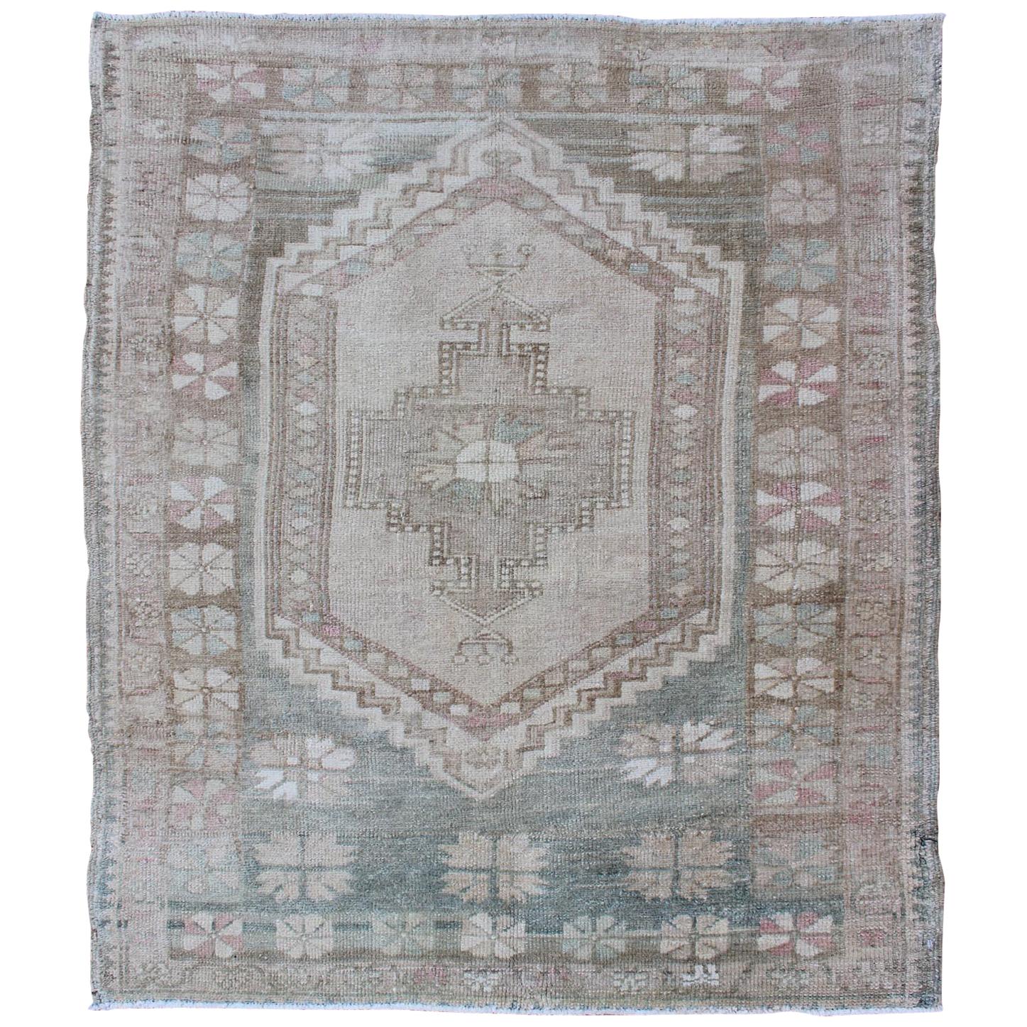 Vintage Turkish Oushak Rug with Stylized Medallion in Soft Green and Creams