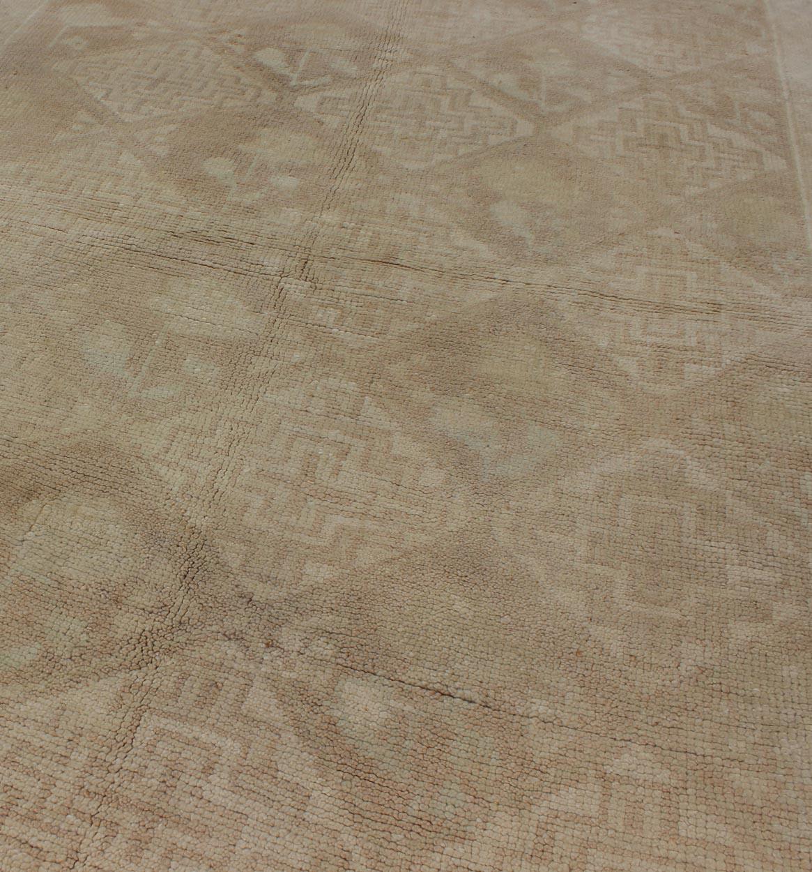 Measures: 3'2 x 5'6
Vintage Turkish Oushak Rug with Subtle Geometric and Floral Motifs 3'2 x 5'6. Keivan Woven Arts / Rug/TU-TRS-136048, country of origin / type: Turkey / Oushak, circa 1940.

This vintage Turkish Oushak rug features a beautifully