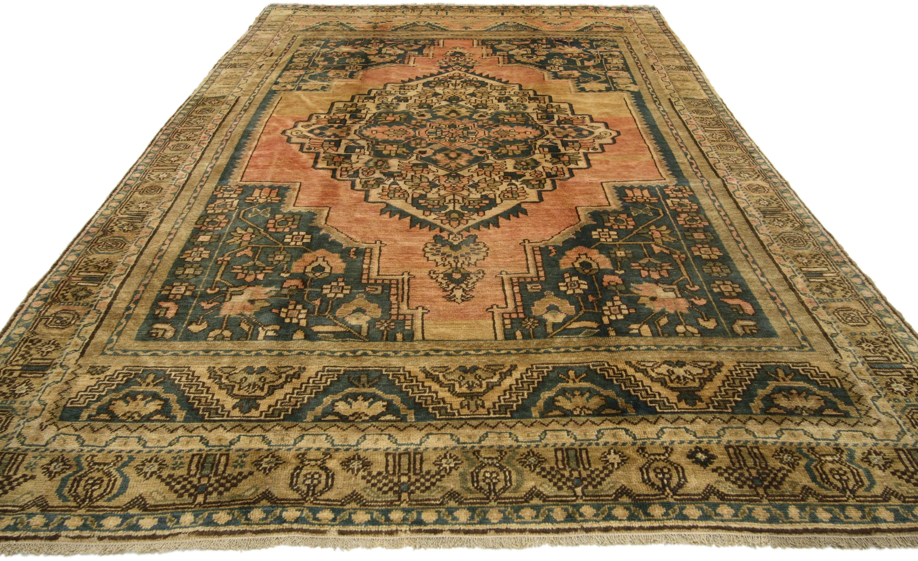 74092, vintage Turkish Oushak rug with traditional style. This hand-knotted wool vintage Turkish Oushak rug features a large-scale center medallion filled with geometric florals in an abrashed pink and ecru field. Cerulean spandrels in each corner