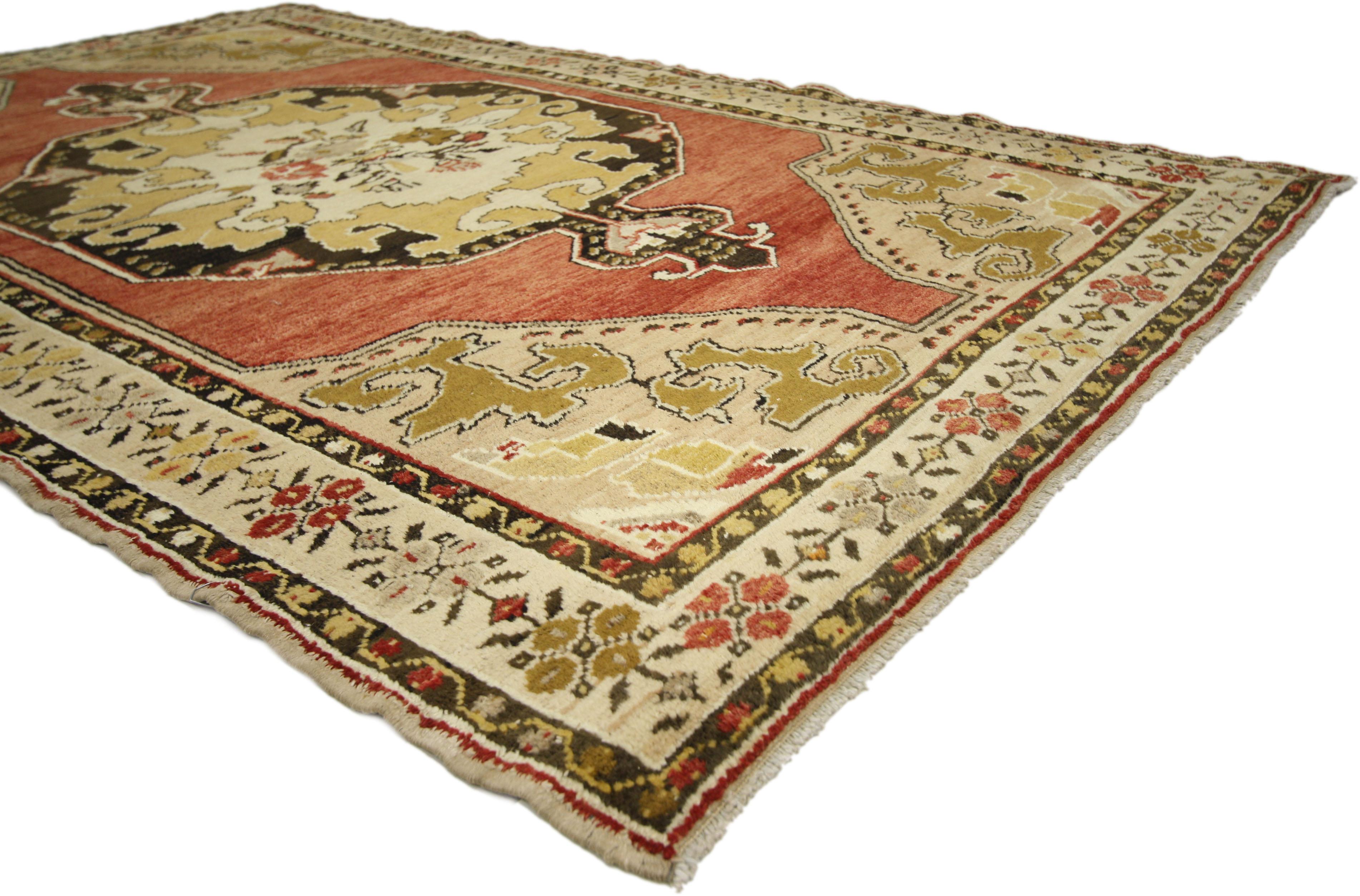 50123, vintage Turkish Oushak rug. This opulent Turkish Oushak rug features a central medallion and corner design. The central medallion features a bouquet with outlined flowers on a creamy-beige background contrasting with black, brown and red. The