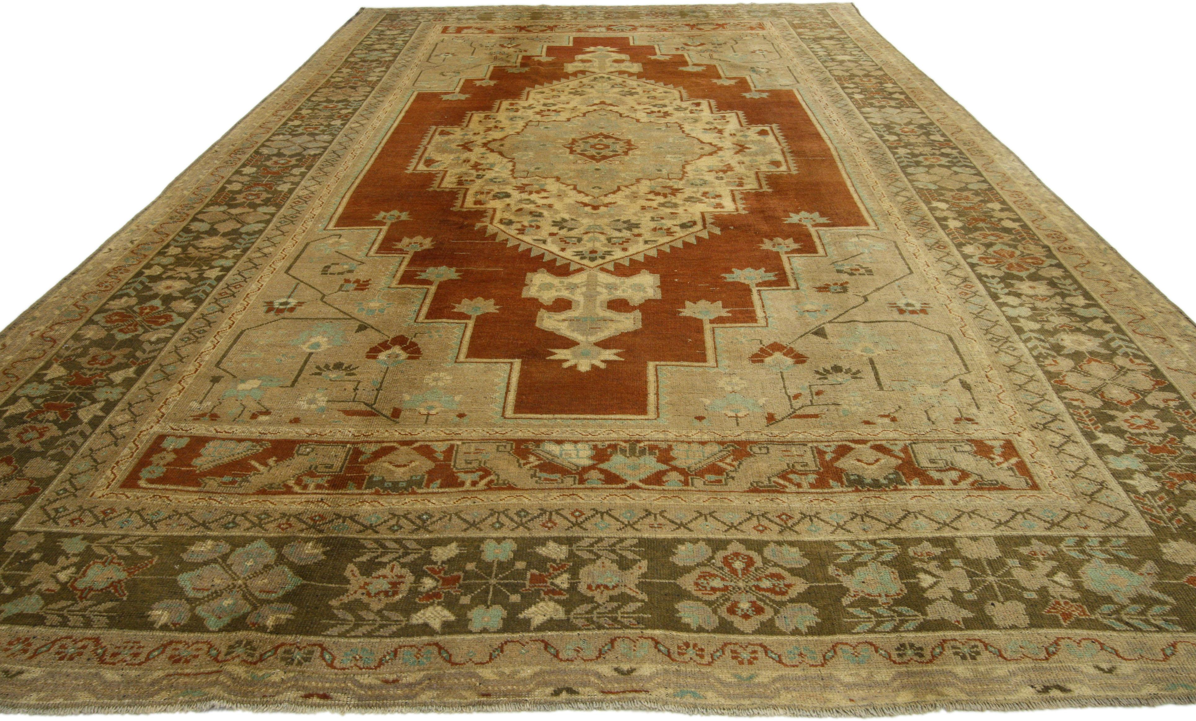 73983, vintage Turkish Oushak rug with traditional style, gallery rug featuring all medallion and corner pattern. This hand-knotted wool vintage Oushak gallery rug displays a stair-step central medallion with two cartouche finials filled with an