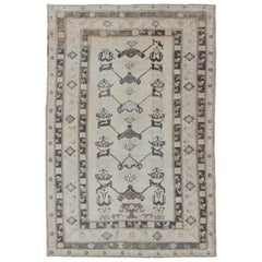 Vintage Turkish Oushak Rug with Tribal Design and Thick Border