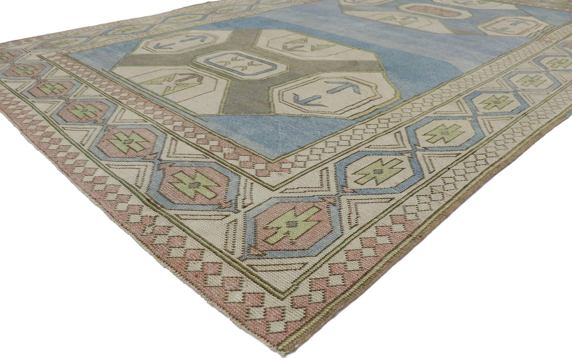 53569 Vintage Turkish Oushak rug with Tribal Style 06'09 x 10'03. With its geometric design and soft colors, this hand-knotted wool vintage Turkish Oushak rug is a captivating vision of woven beauty. The abrashed sky blue field features two