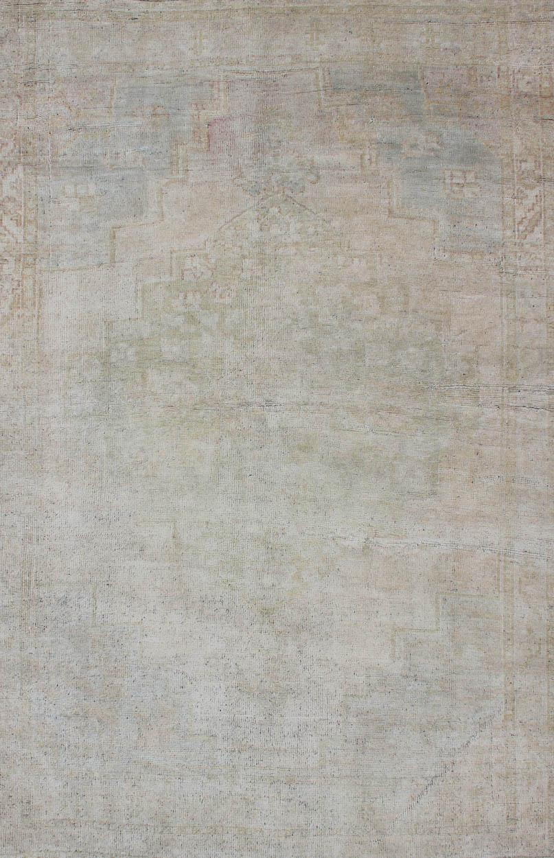 Hand-Knotted Vintage Turkish Oushak Rug with Understated Design and Muted Tones For Sale