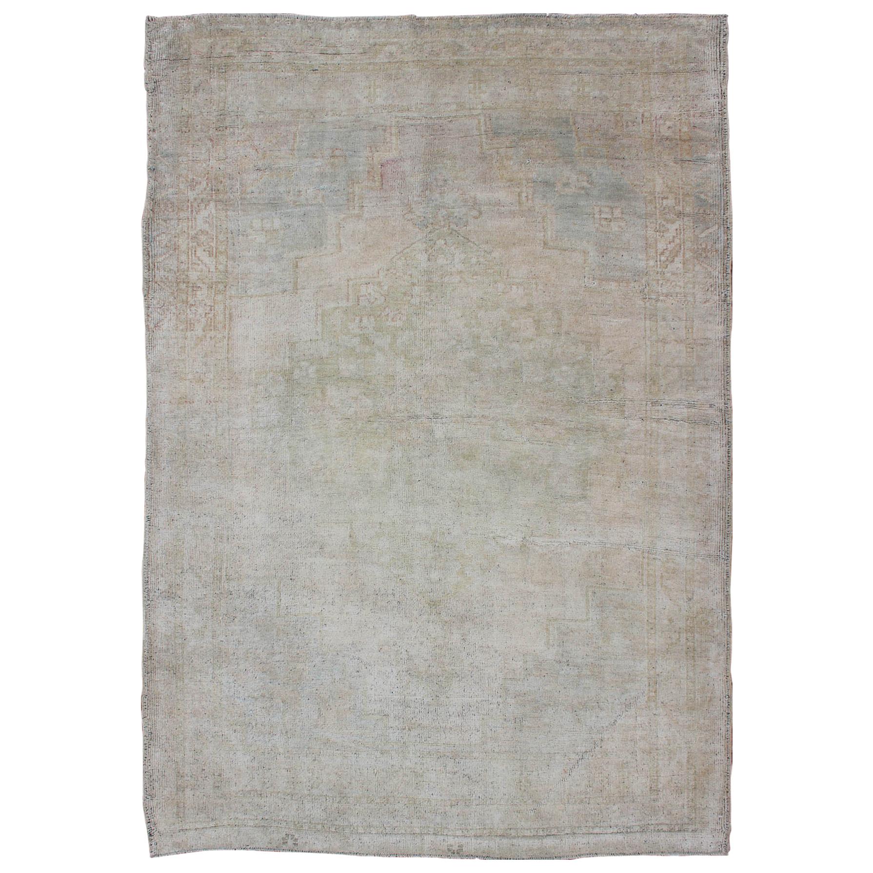 Vintage Turkish Oushak Rug with Understated Design and Muted Tones For Sale