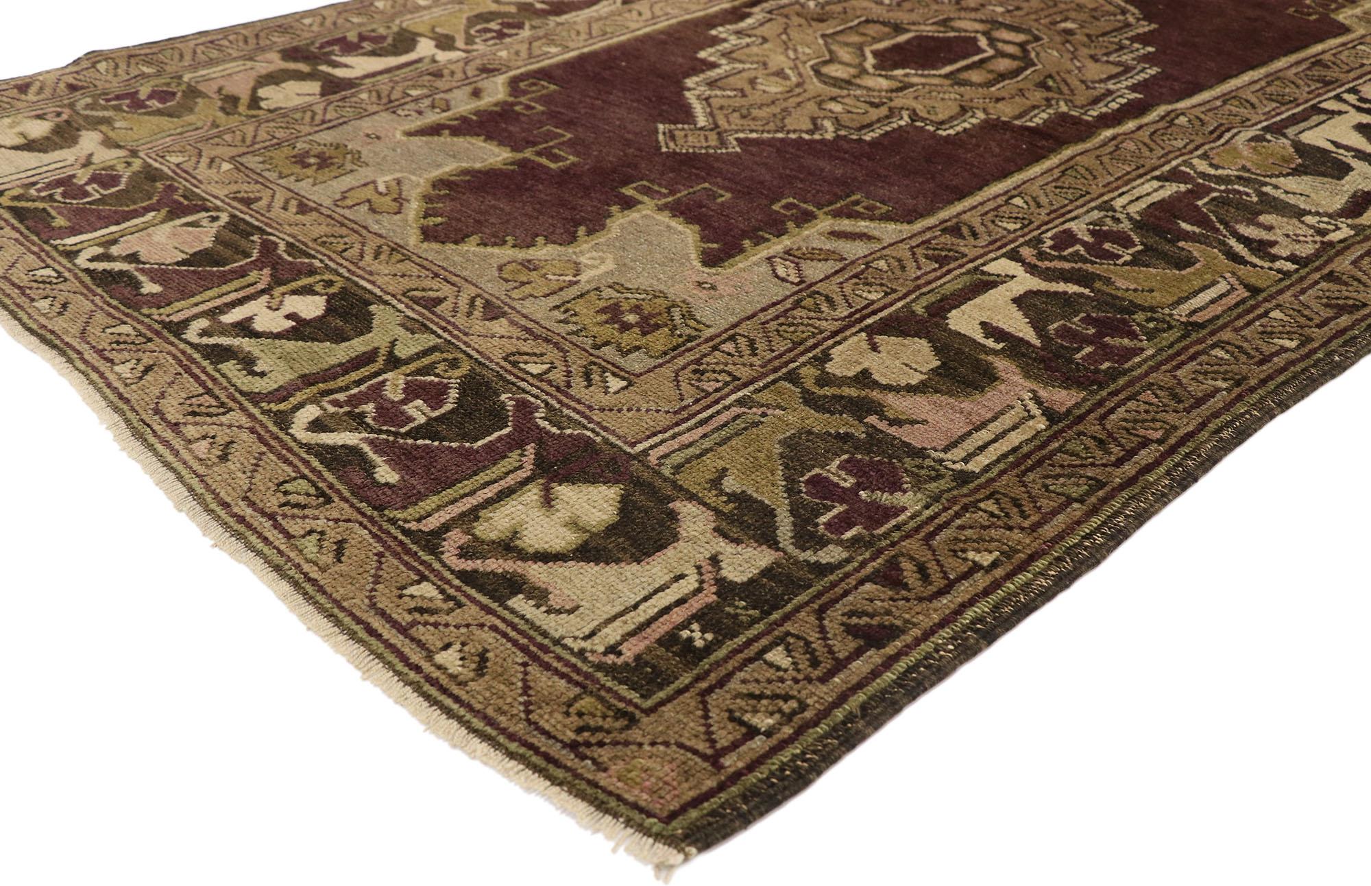 50112, vintage Turkish Oushak rug with Venetian Renaissance style. Warm and inviting, this hand knotted vintage Turkish Oushak rug features a stepped central medallion in an open abrashed eggplant colored field. Angular florals and foliage adorn
