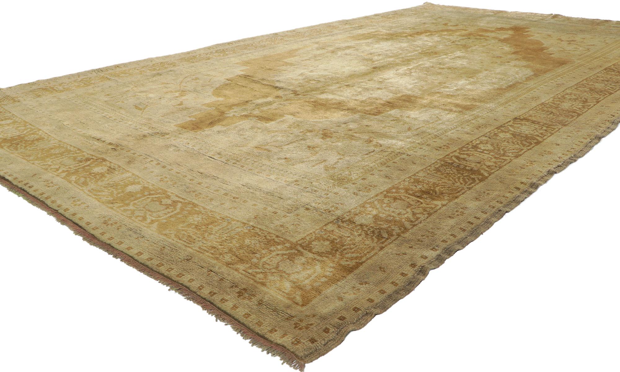 50520 vintage Turkish Oushak rug with warm, Feminine Rustic style, Hallway Runner. Warm, feminine rustic style meets unpretentious and simple. This hand knotted wool vintage Turkish Oushak rug features a large scale cusped medallion filled with