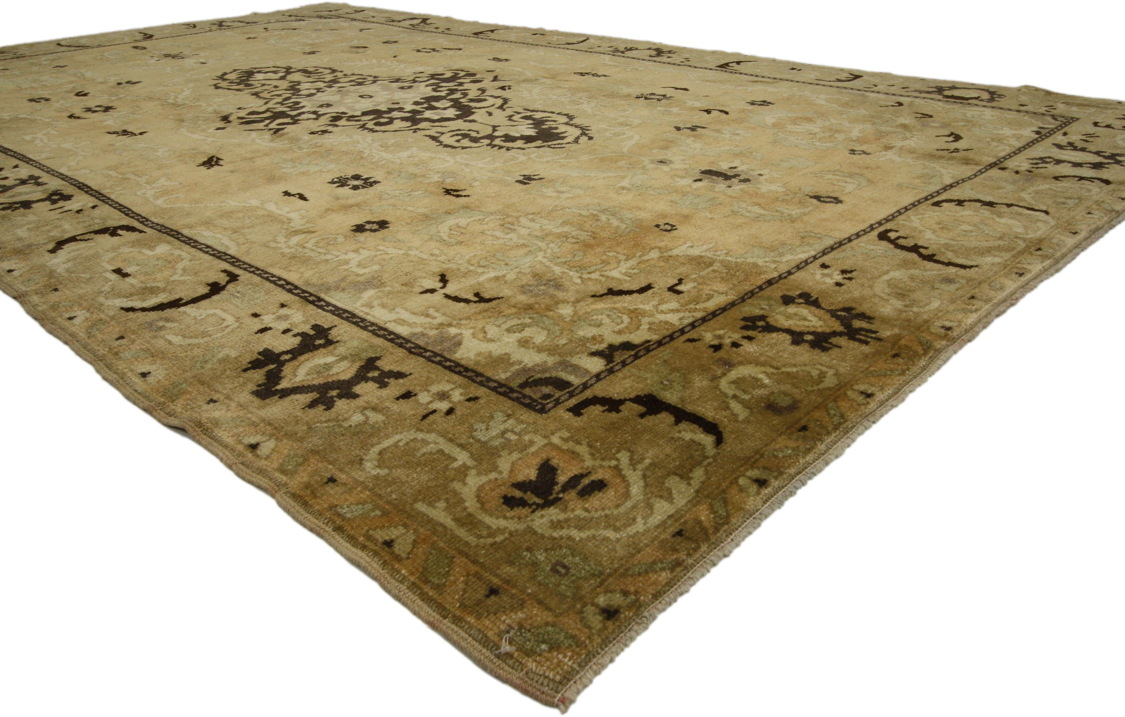 73761 vintage Turkish Oushak rug with warm Russian Dachas Luxe Home style. This hand knotted wool vintage Turkish Oushak rug features an ornate center medallion with curled leafy tendril extensions outlined in a frondescence of acanthus leaves. The