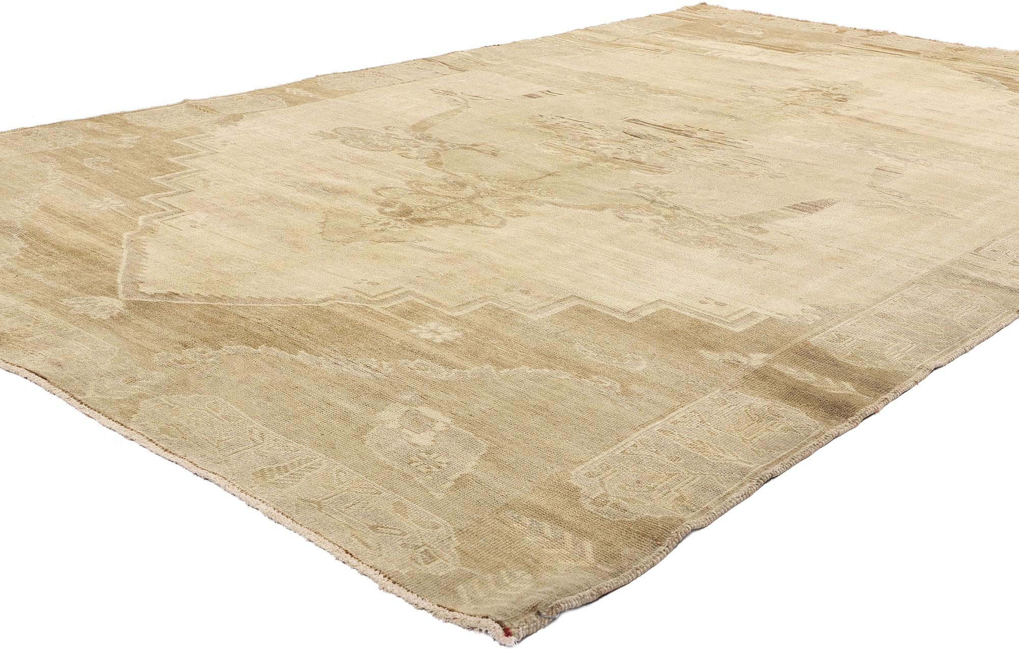 51381 Vintage Turkish Oushak Rug, 06'06 x 10'11. Bathed in the faded warmth of Anatolian sunrises, this hand-knotted vintage Turkish Oushak rug unveils its legacy in whisper-soft hues of fawn, sand, and ethereal desert blush. An antique-wash has