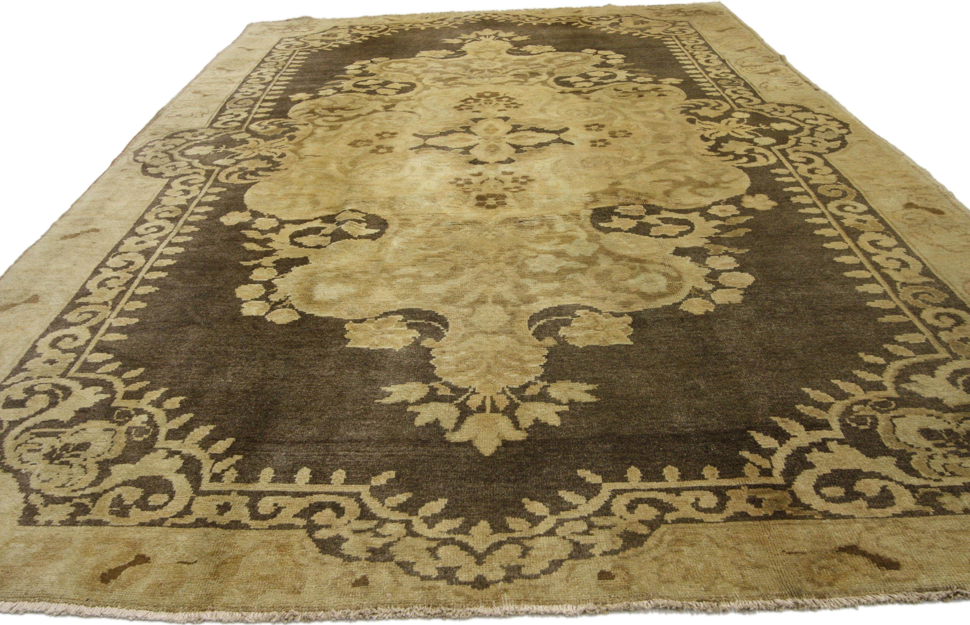 50042 Vintage Turkish Oushak Rug with Warm, Neutral Colors 06'11 x 11'00. A grand golden hued filigree medallion with an undulating border replete with floral sits regally on a rich coffee colored field in this luxurious, neutral area rug. The