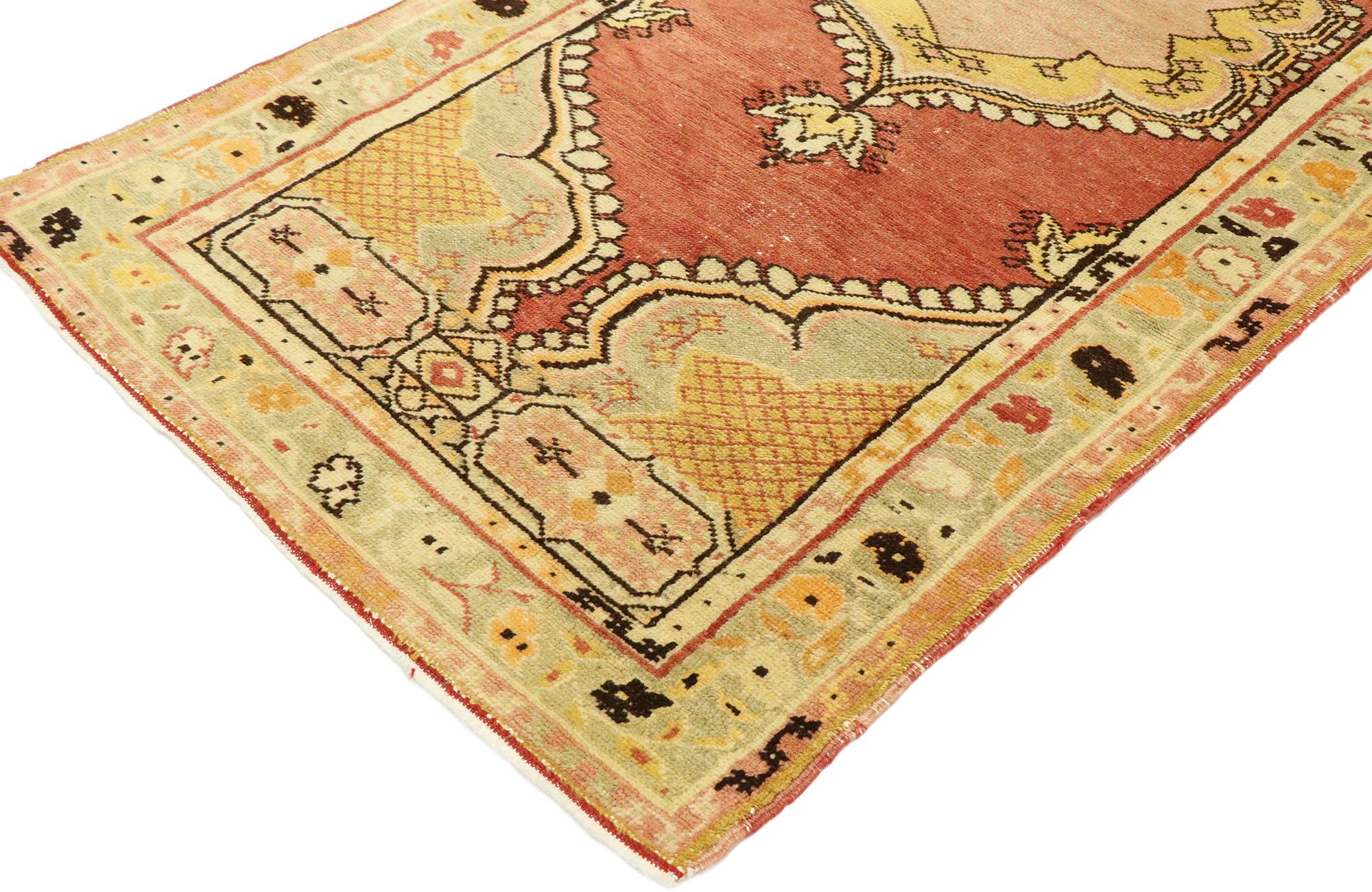 53057, vintage Turkish Oushak rug with Warm Spanish style. Effortless beauty and soft, bespoke vibes meet warm Spanish style in this hand knotted wool vintage Turkish Oushak rug. The open abrashed rust colored field features a cusped central