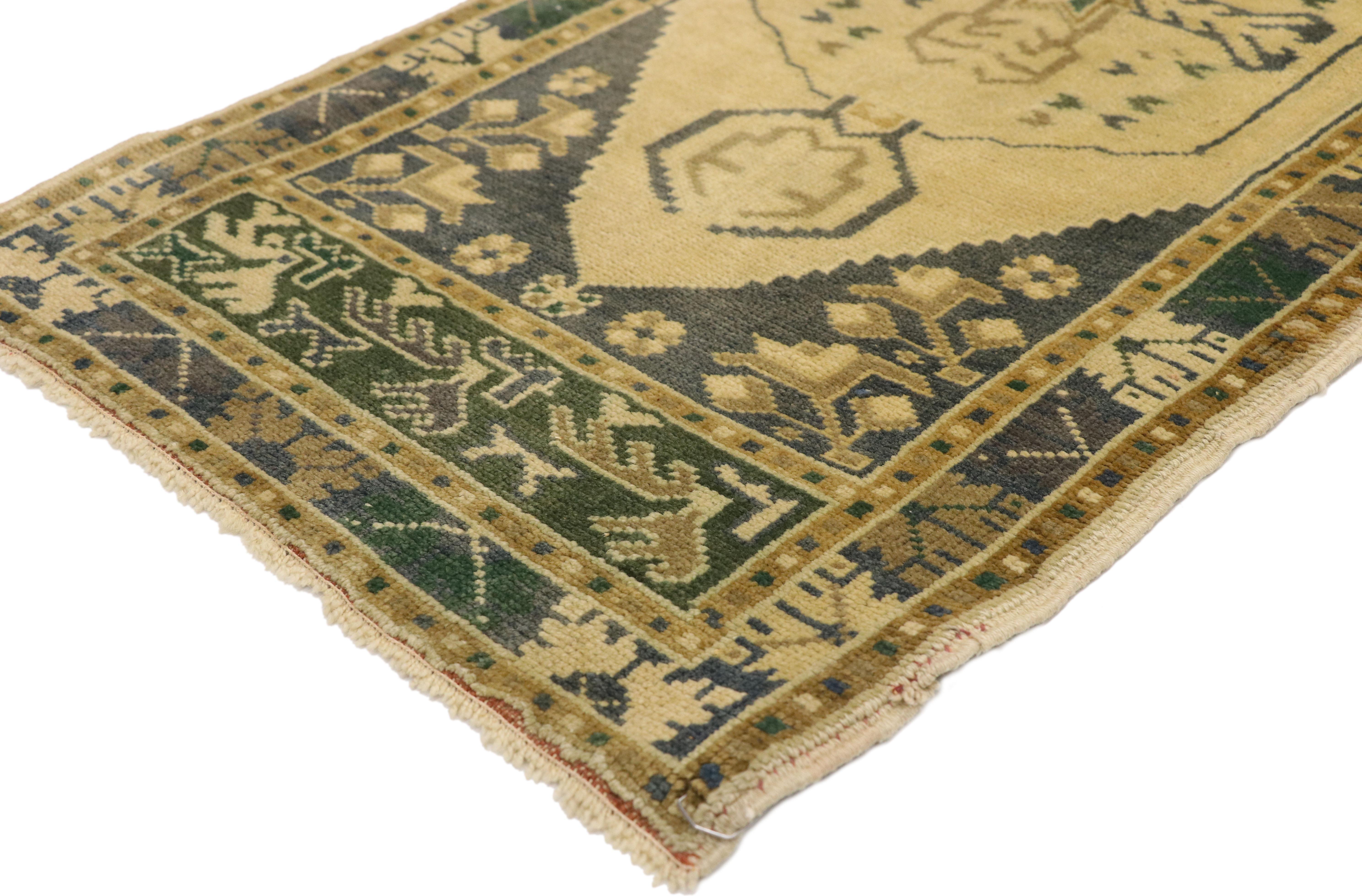50610 Vintage Turkish Oushak Yastik Scatter Rug, Small Accent Rug 01'09 x 03'10. This hand knotted wool vintage Turkish Oushak yastik scatter rug features a hexagonal central medallion patterned inside with a cross motif, eight-point star, and