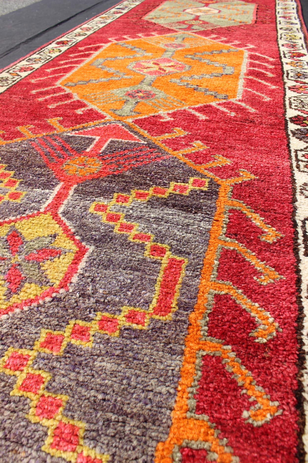 Mid-20th Century Vintage Turkish Oushak Runner with Bright and Colorful Medallion Design For Sale