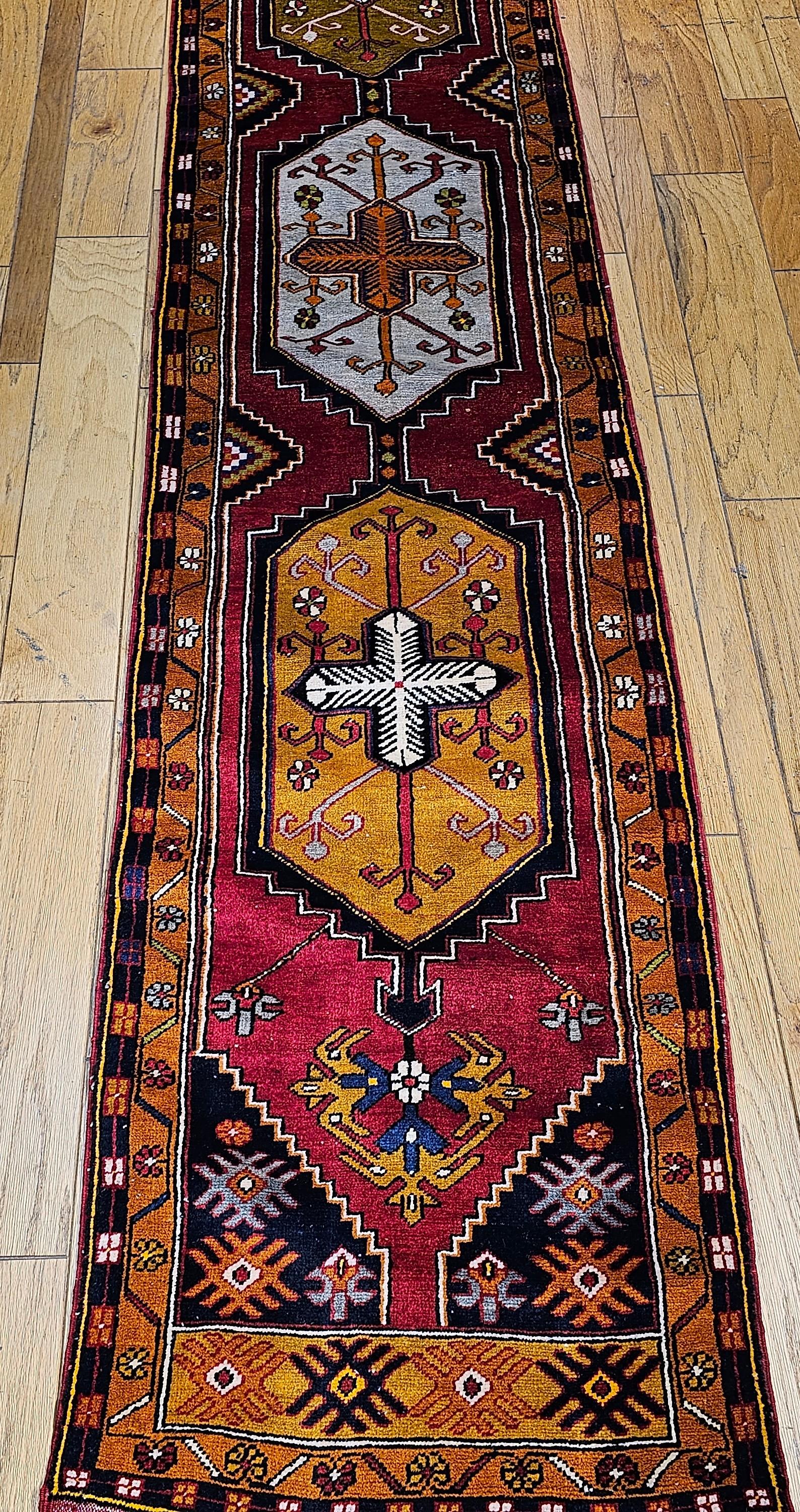 Vintage Turkish Oushak Runner – Red Field with Gold & Ivory Geometric Medallions

Dimensions:  2’ 10” x 14’ 8”
Date of Manufacture:  2nd Quarter of the 1900s
Place of Origin:  Turkey
Material:  Wool pile on a wool foundation 
Condition:  Wear
