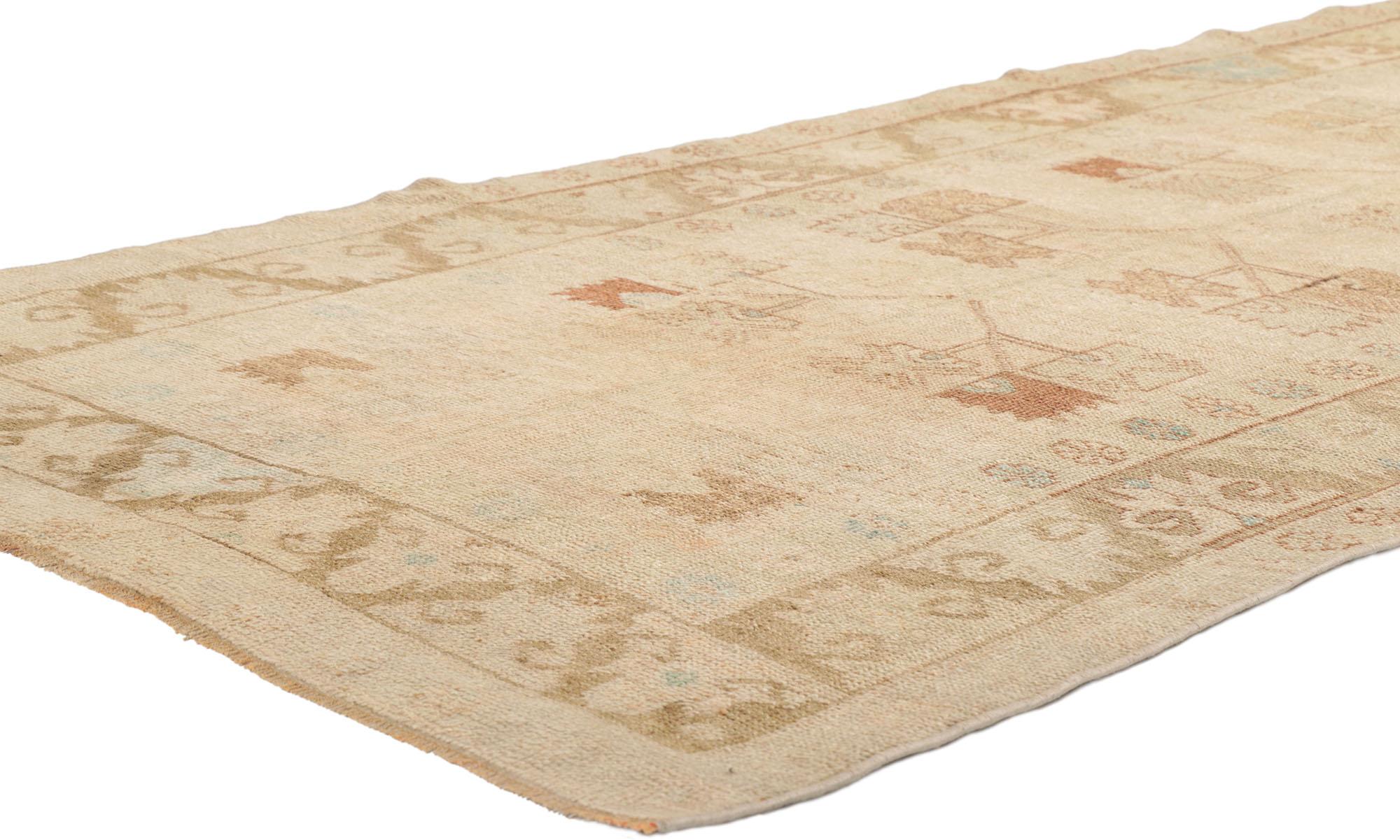 53704 Vintage Turkish Oushak Rug, 03'08 x 09'09.
​With a nod to Shubi and understated elegance, this hand knotted wool vintage Turkish Oushak rug is a masterclass in texture and detail. It's neutral earth-tone colors and geometric botanical shapes