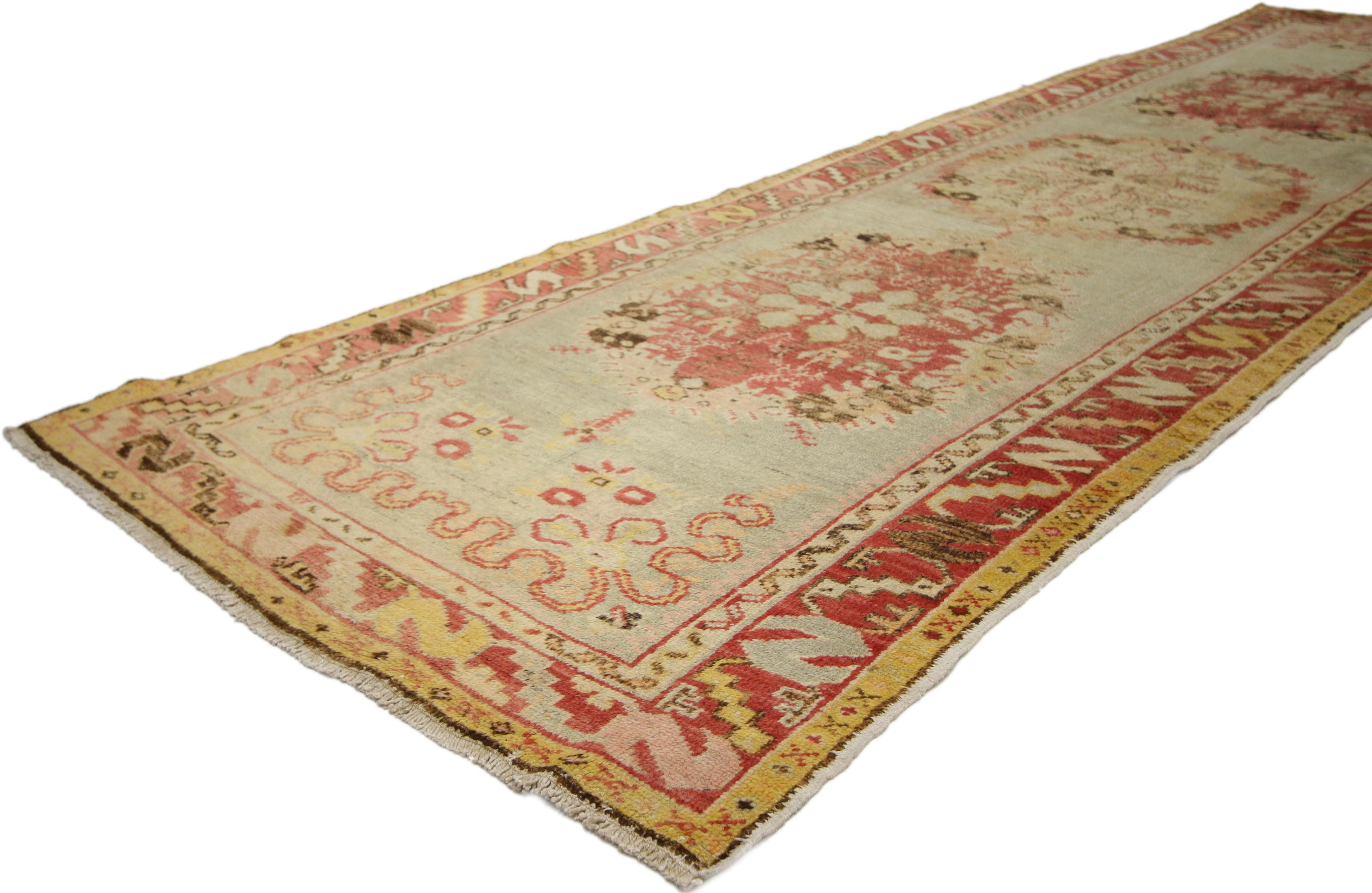 50361 Distressed Vintage Turkish Oushak Runner with Romantic French Country Style 03’03 x 10’10. French Country and Romantic Rusticity meets timeless Anatolian tradition in this hand knotted wool distressed vintage Turkish Oushak runner. Set with