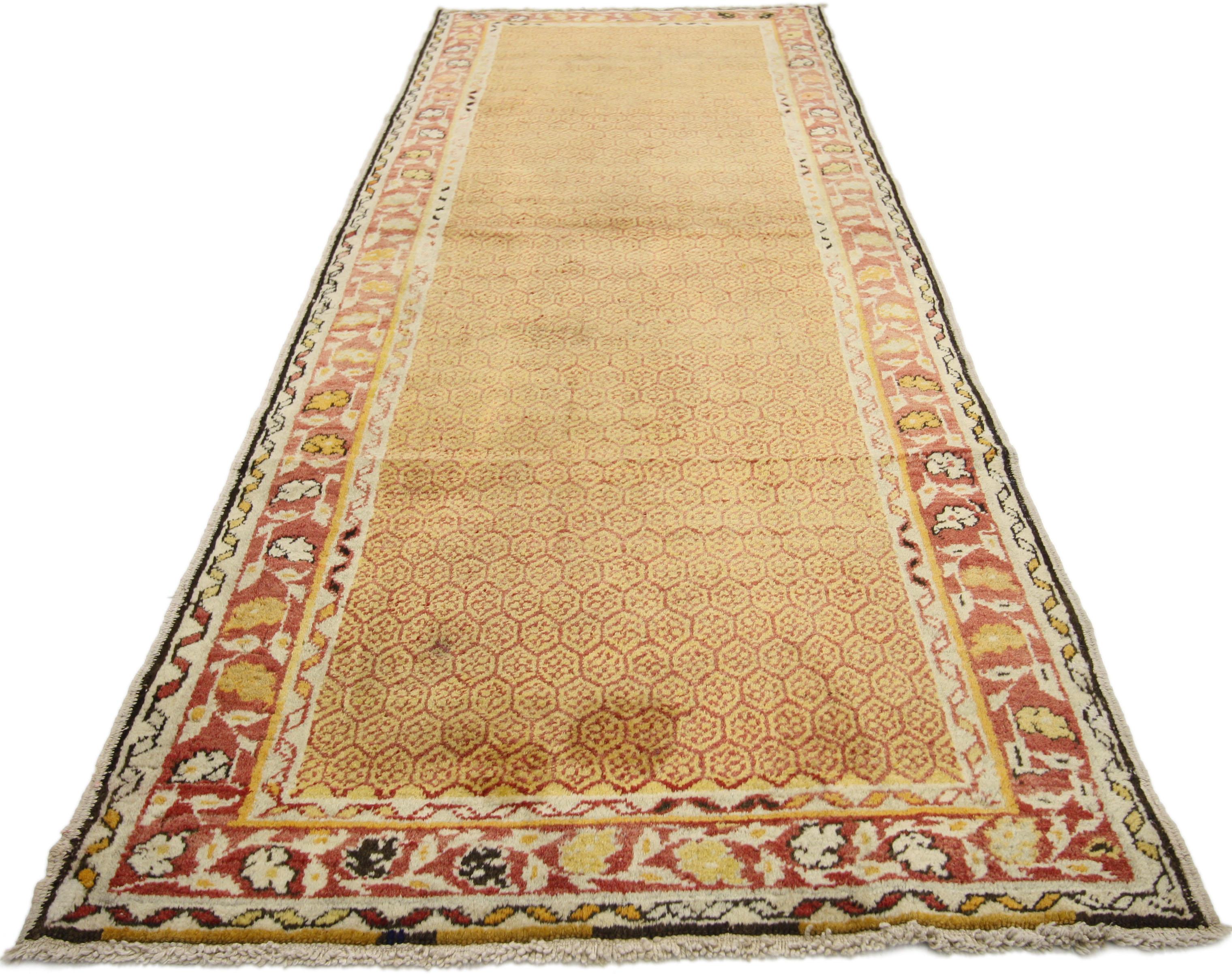 50006 Vintage Turkish Oushak Runner, Hallway Runner with Craftsman Art Deco Style 02'11 X 08'00. This hand knotted wool vintage Turkish Oushak runner features an all-over honeycomb lattice pattern overlaid upon an abrashed red field. Each hexagonal