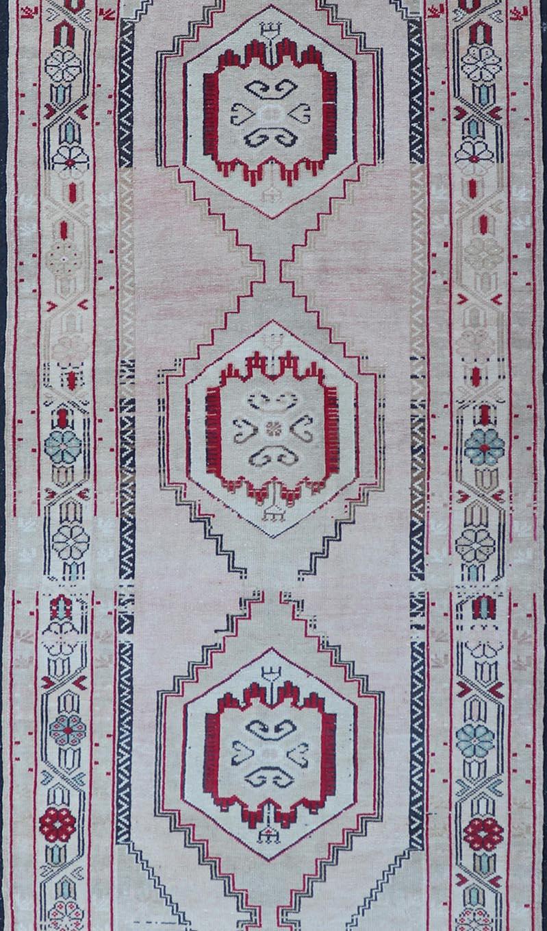 Vintage Turkish Oushak Runner in Cream, Dark Blue, Pink and Red In Good Condition For Sale In Atlanta, GA