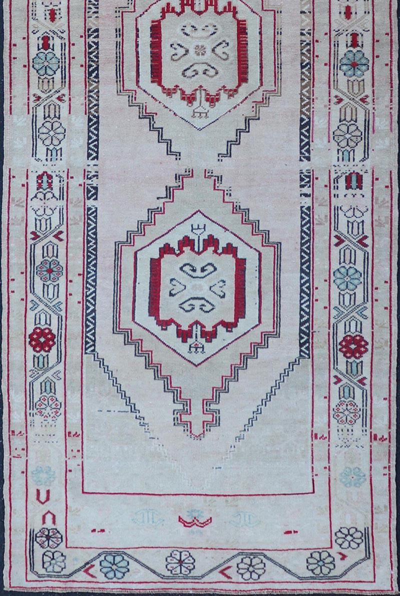 20th Century Vintage Turkish Oushak Runner in Cream, Dark Blue, Pink and Red For Sale