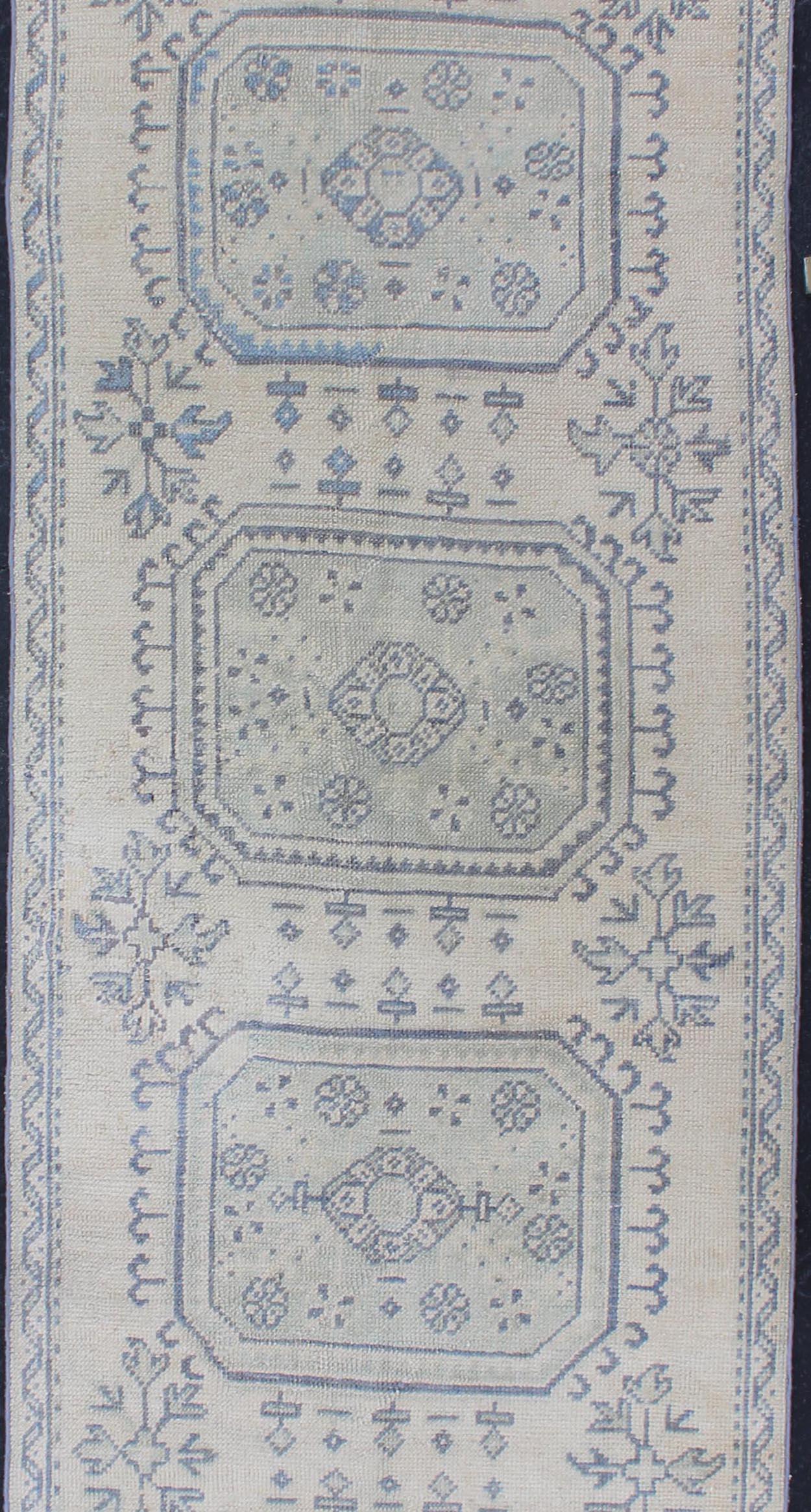 Hand-Knotted Vintage Turkish Oushak Runner in Faded Blue in Neutral Background For Sale
