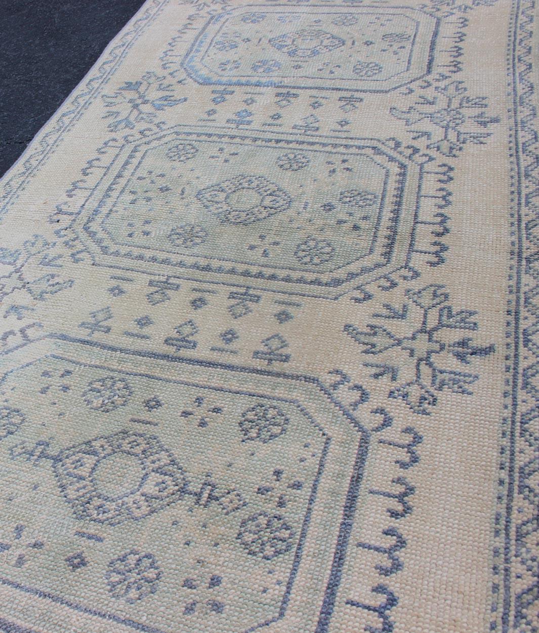 Wool Vintage Turkish Oushak Runner in Faded Blue in Neutral Background For Sale