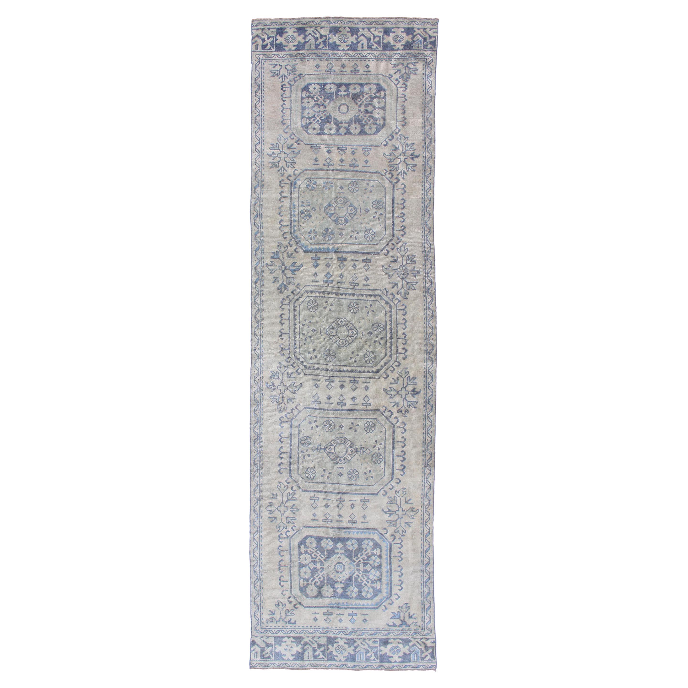 Vintage Turkish Oushak Runner in Faded Blue in Neutral Background