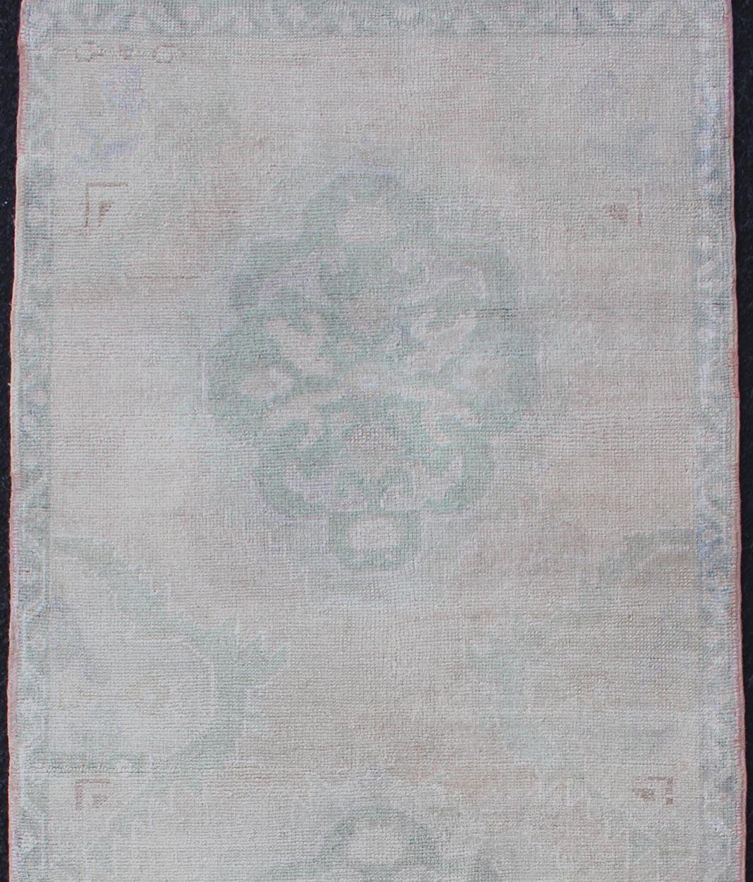 Hand-Knotted Vintage Turkish Oushak Runner in Faded Green and Blue in Neutral Background For Sale