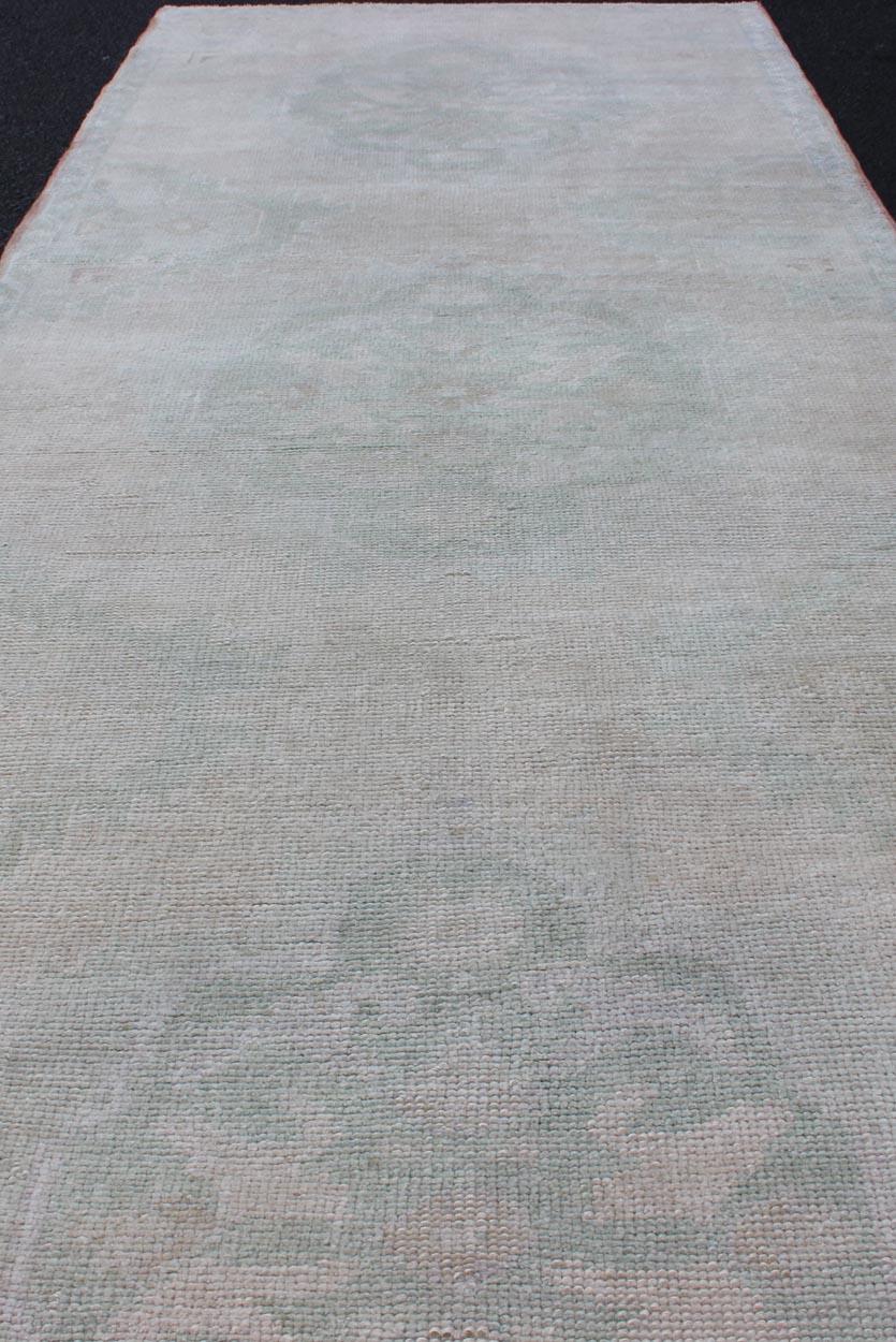 Wool Vintage Turkish Oushak Runner in Faded Green and Blue in Neutral Background For Sale