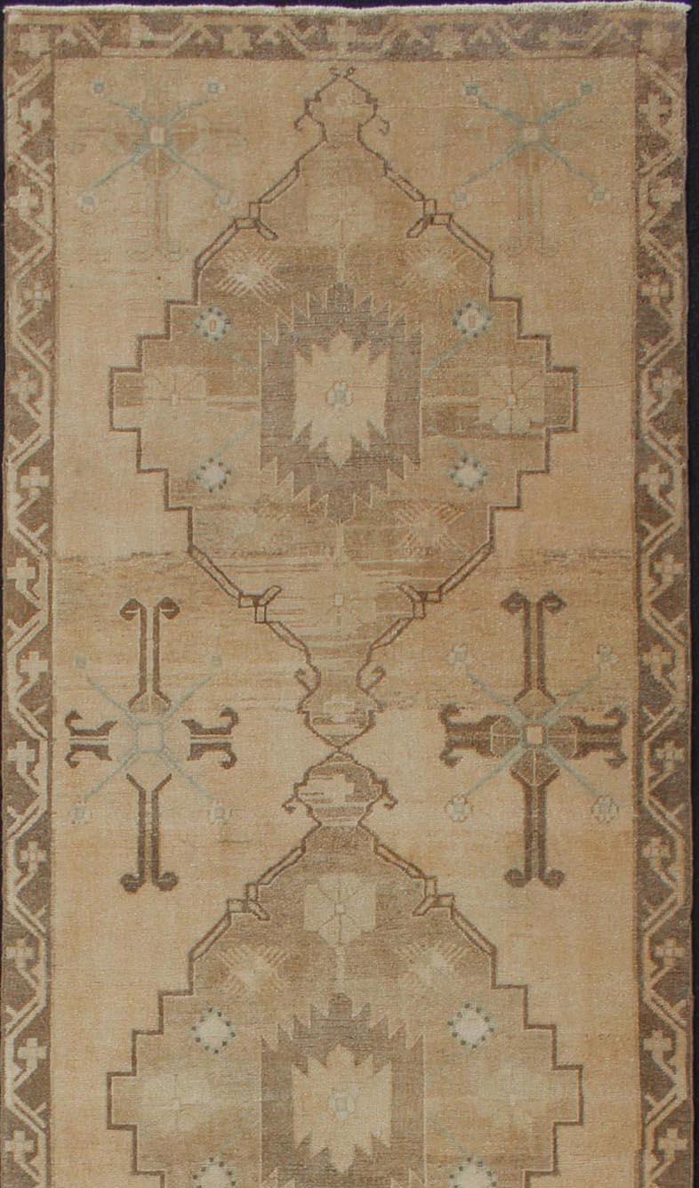Hand-Knotted Vintage Turkish Oushak Runner Neutral and warm Colors with Tribal Medallions For Sale