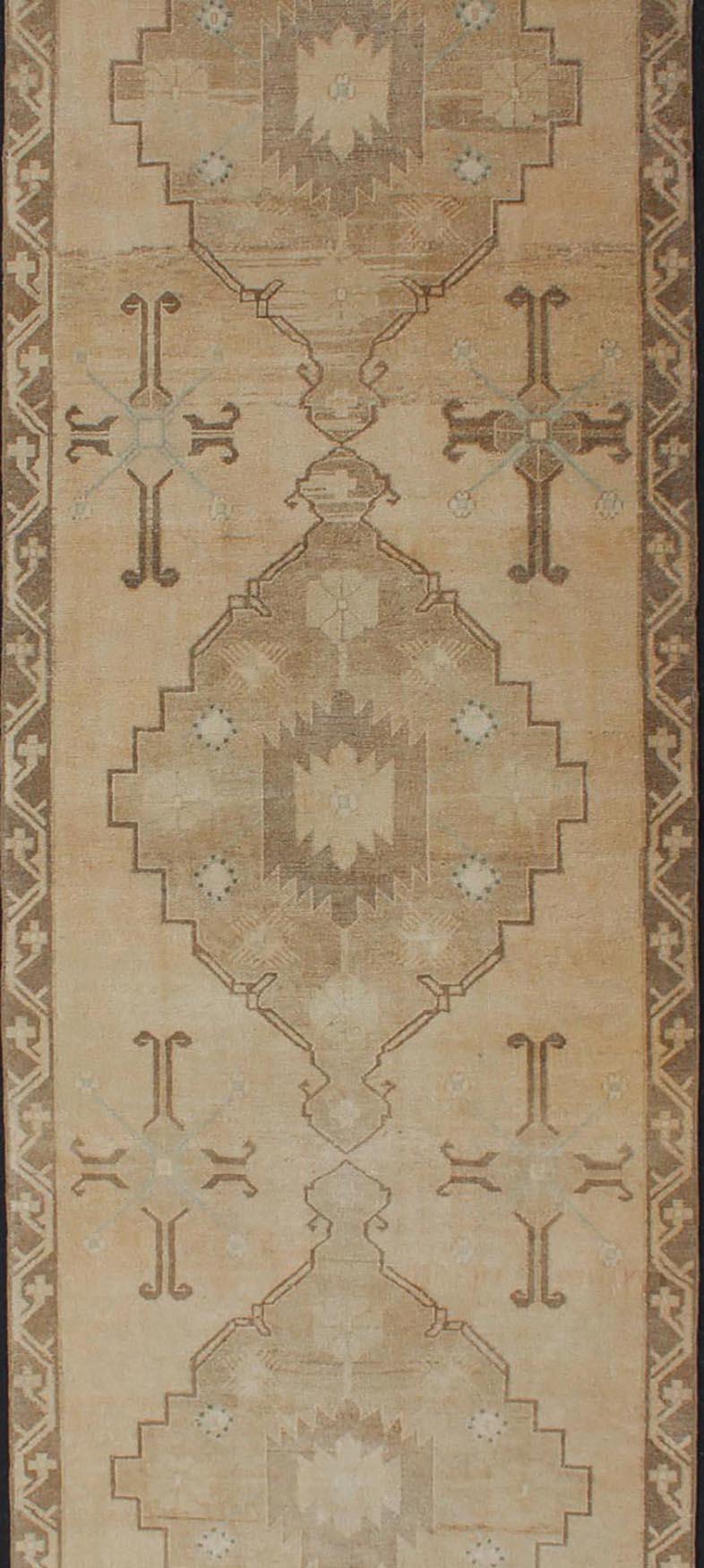 Vintage Turkish Oushak Runner Neutral and warm Colors with Tribal Medallions In Good Condition For Sale In Atlanta, GA