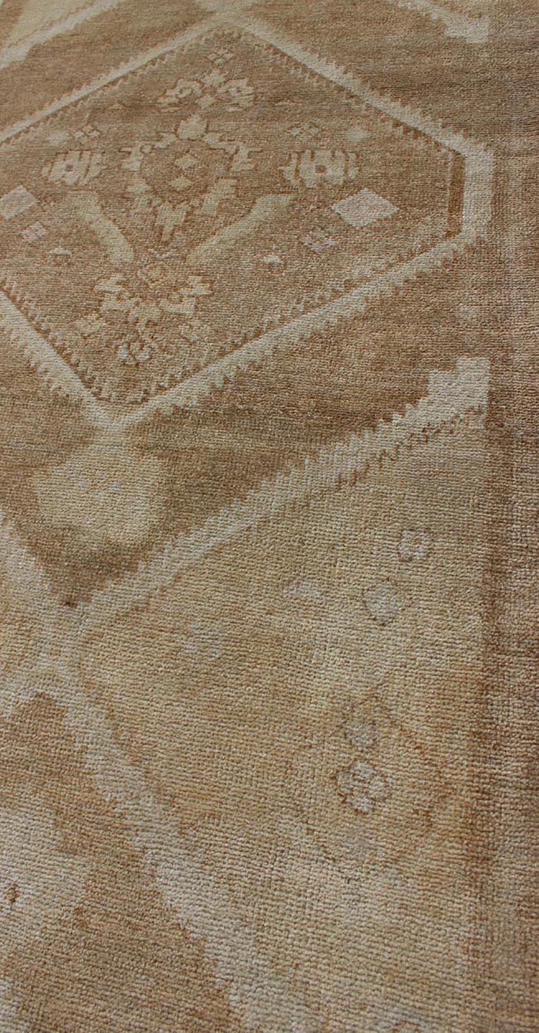 Wool Vintage Turkish Oushak Runner Neutral and Warm Colors with Tribal Medallions For Sale