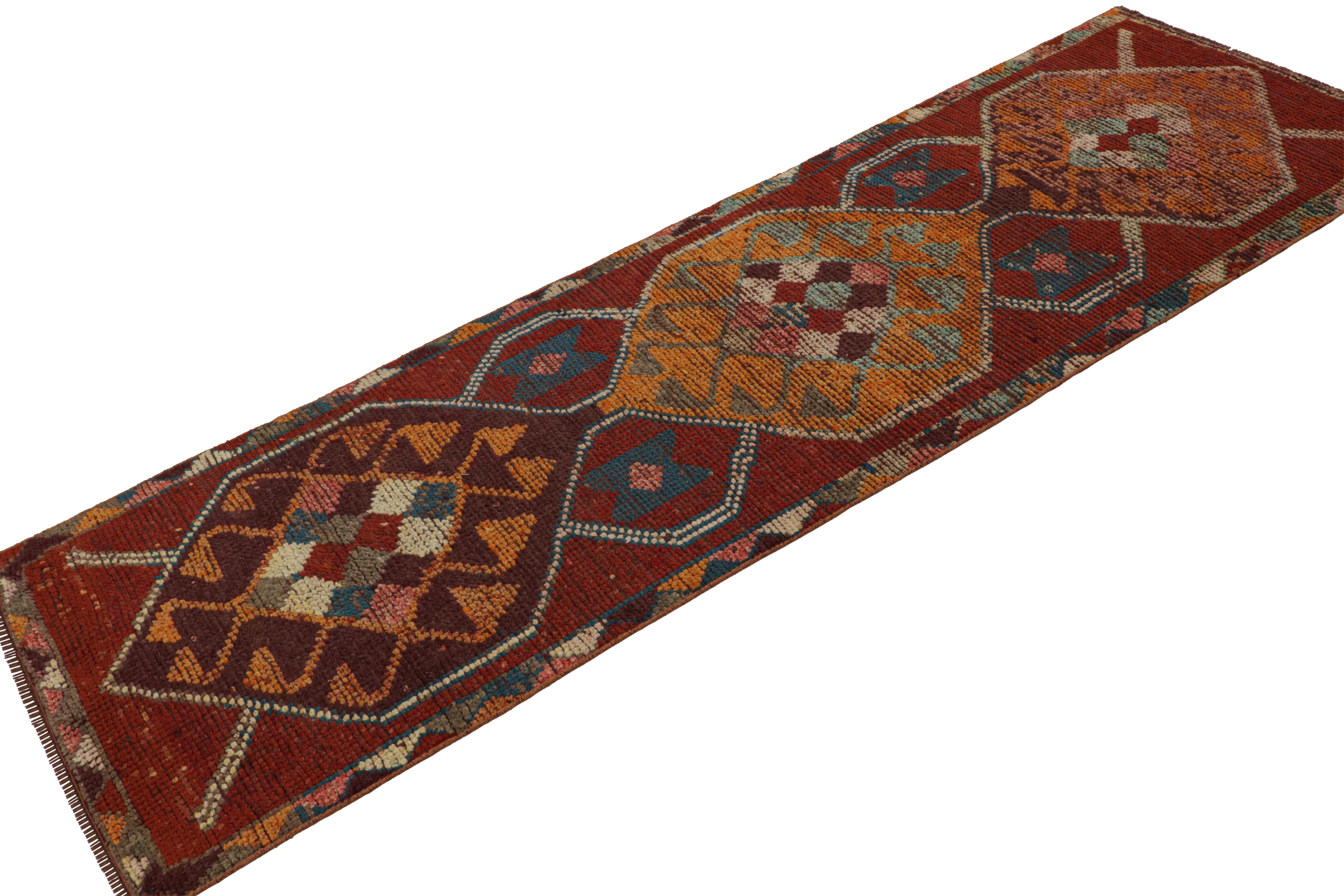 Hand Knotted in wool, this vintage 3x9 Turkish Oushak runner rug in red features a central medallion and geometric patterns in especially rare colors considering its mid-century provenance. 

On the Design: 

Connoisseurs will admire this vintage