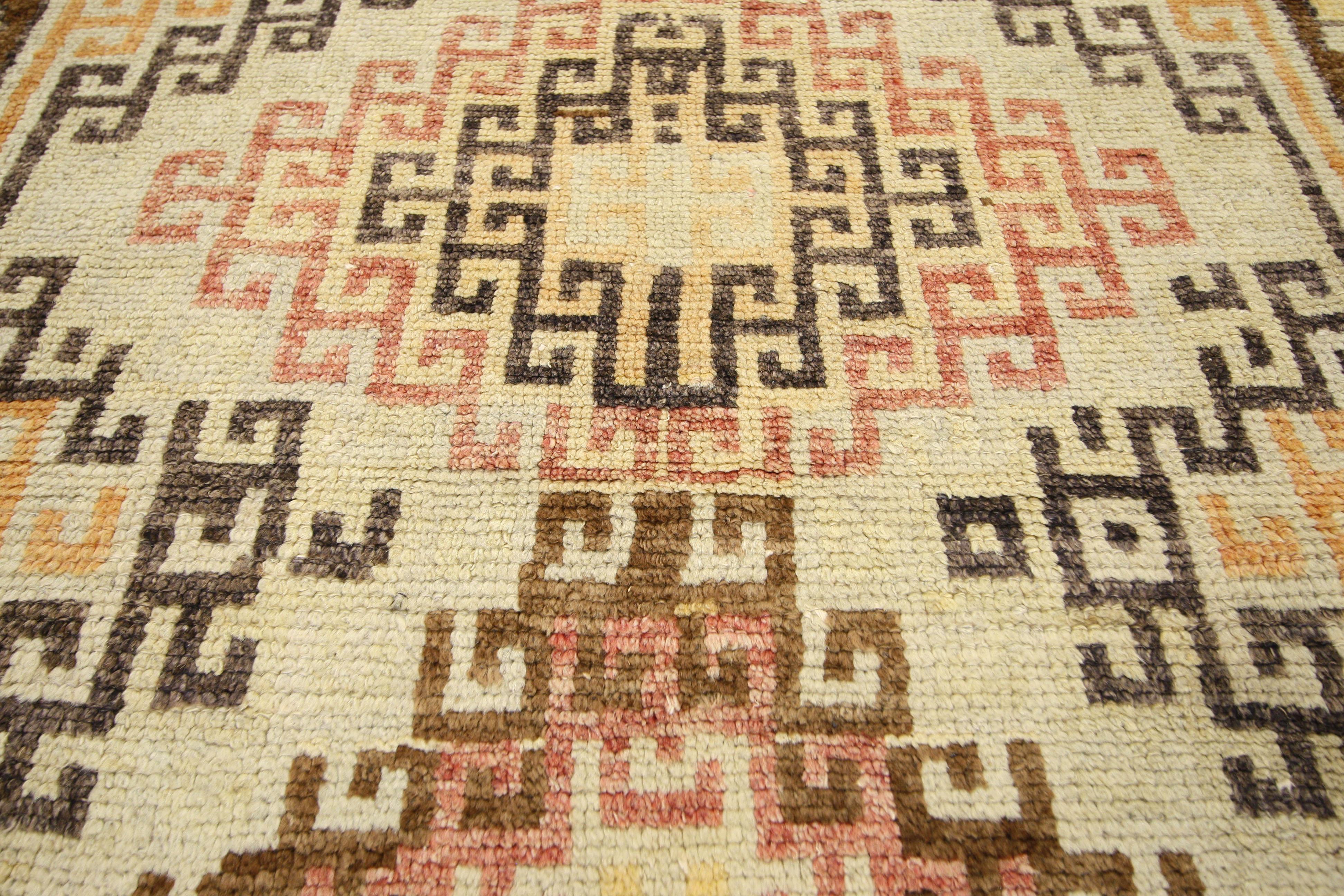 50288, vintage Turkish Oushak runner, wide hallway runner. Dazzling like a tilt a whirl of flower petals, this hand knotted wool vintage Turkish Oushak runner features a playful, colorful display. A row of linear, multi-color hooked diamonds creates