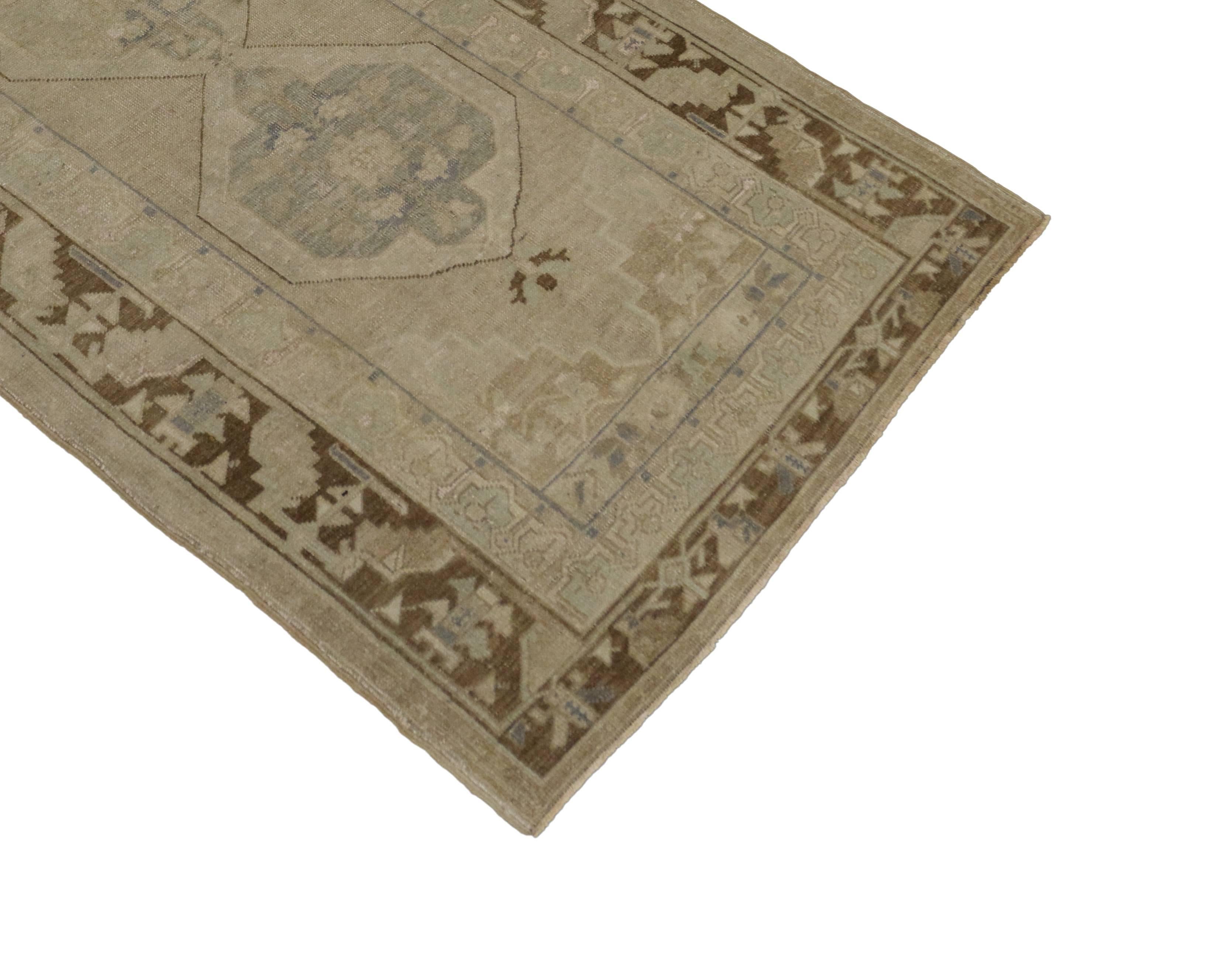 50988 Vintage Turkish Oushak runner, wide Hallway runner 04.02 X 08.08. This hand-knotted wool vintage Turkish Oushak runner features two stacked hexagonal medallions with palmette finials in an abrashed field framed by stair-step spandrels. A