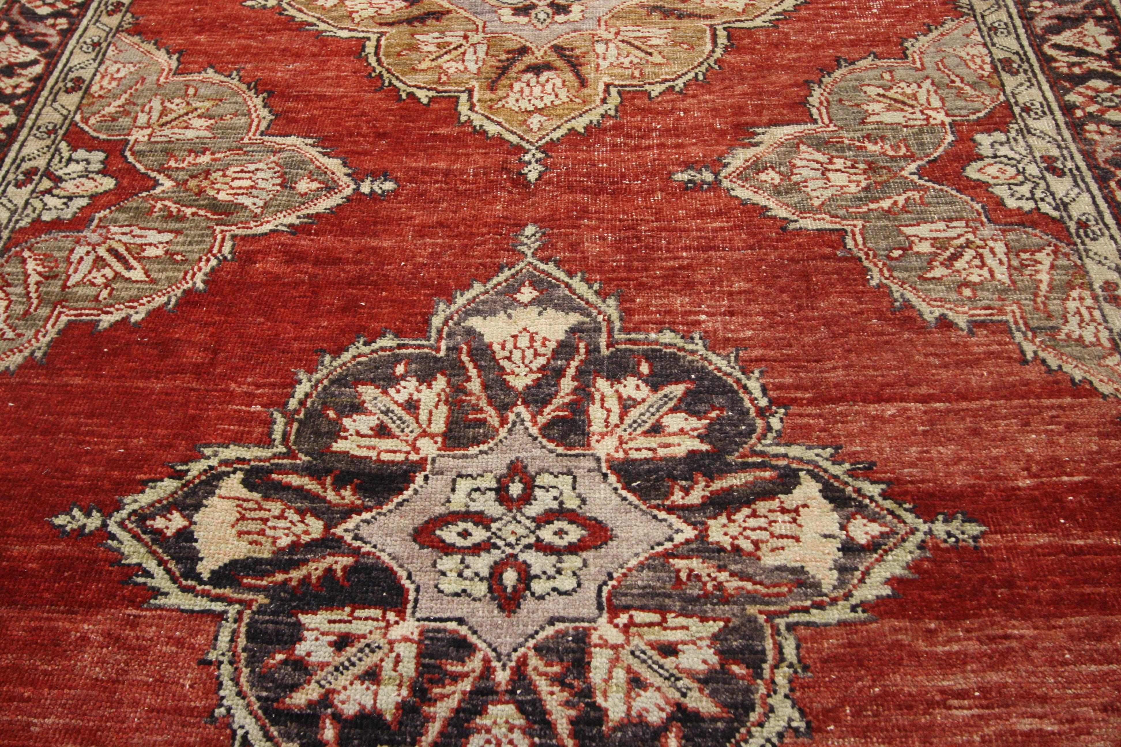 52387 Vintage Turkish Oushak Gallery Rug, Wide Hallway Runner 04'11 x 13'06. This hand knotted wool vintage Turkish Oushak runner features five floral lobed diamond-shaped medallions spread across an abrashed red field. The petal-shaped lobes of the