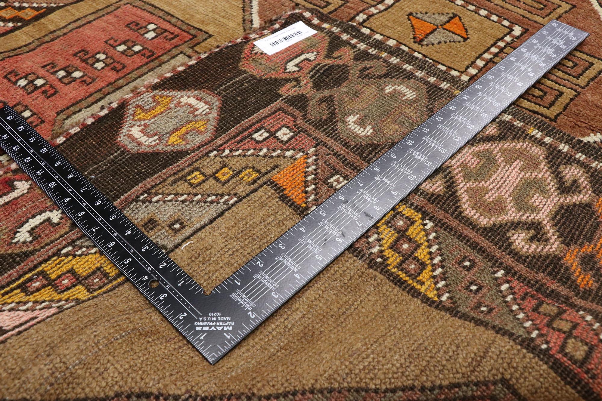 52062 Vintage Turkish Oushak Runner, 04'06 x 13'00. Warm and inviting with incredible detail and texture, this hand knotted vintage Turkish Oushak runner is a captivating vision of woven beauty. The eye-catching tribal elements and earthy colorway