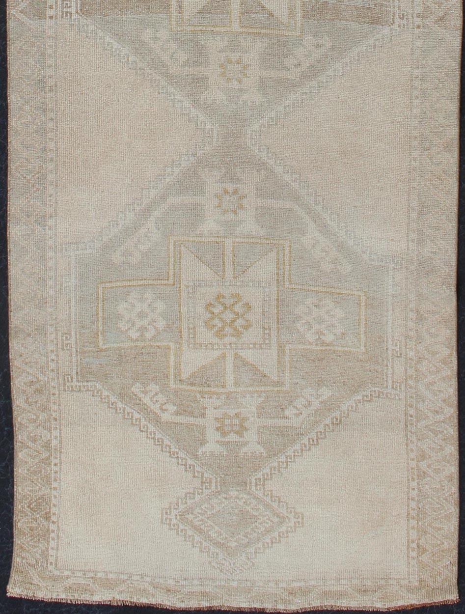 Hand-Knotted Vintage Turkish Oushak Runner with Etched Medallion Design in Soft Muted Tones For Sale