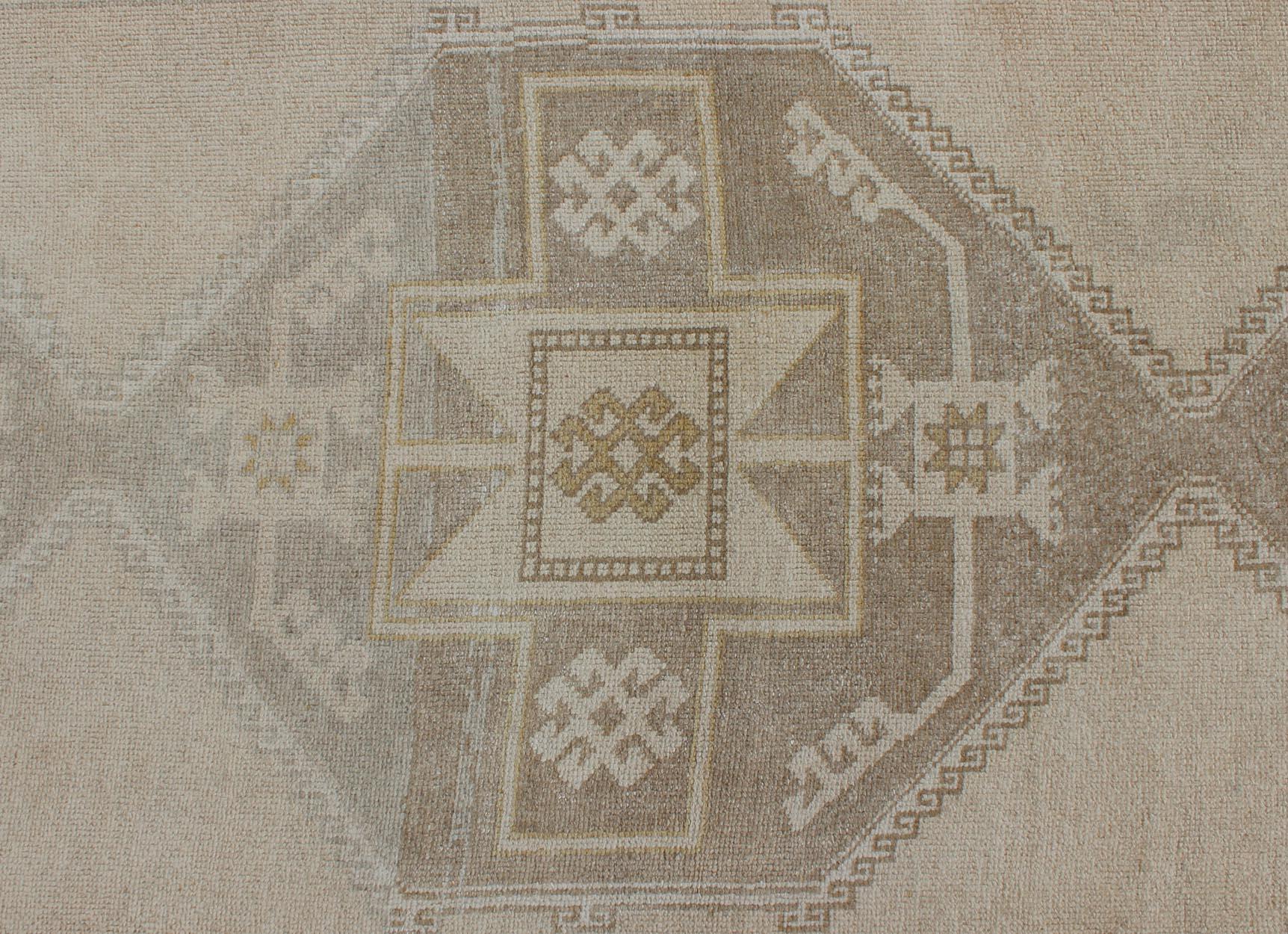 Wool Vintage Turkish Oushak Runner with Etched Medallion Design in Soft Muted Tones For Sale
