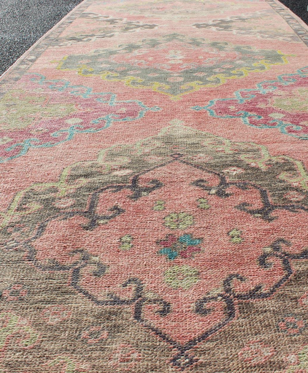 20th Century Colorful Vintage Hand Knotted Turkish Oushak Runner in Muted Tones For Sale