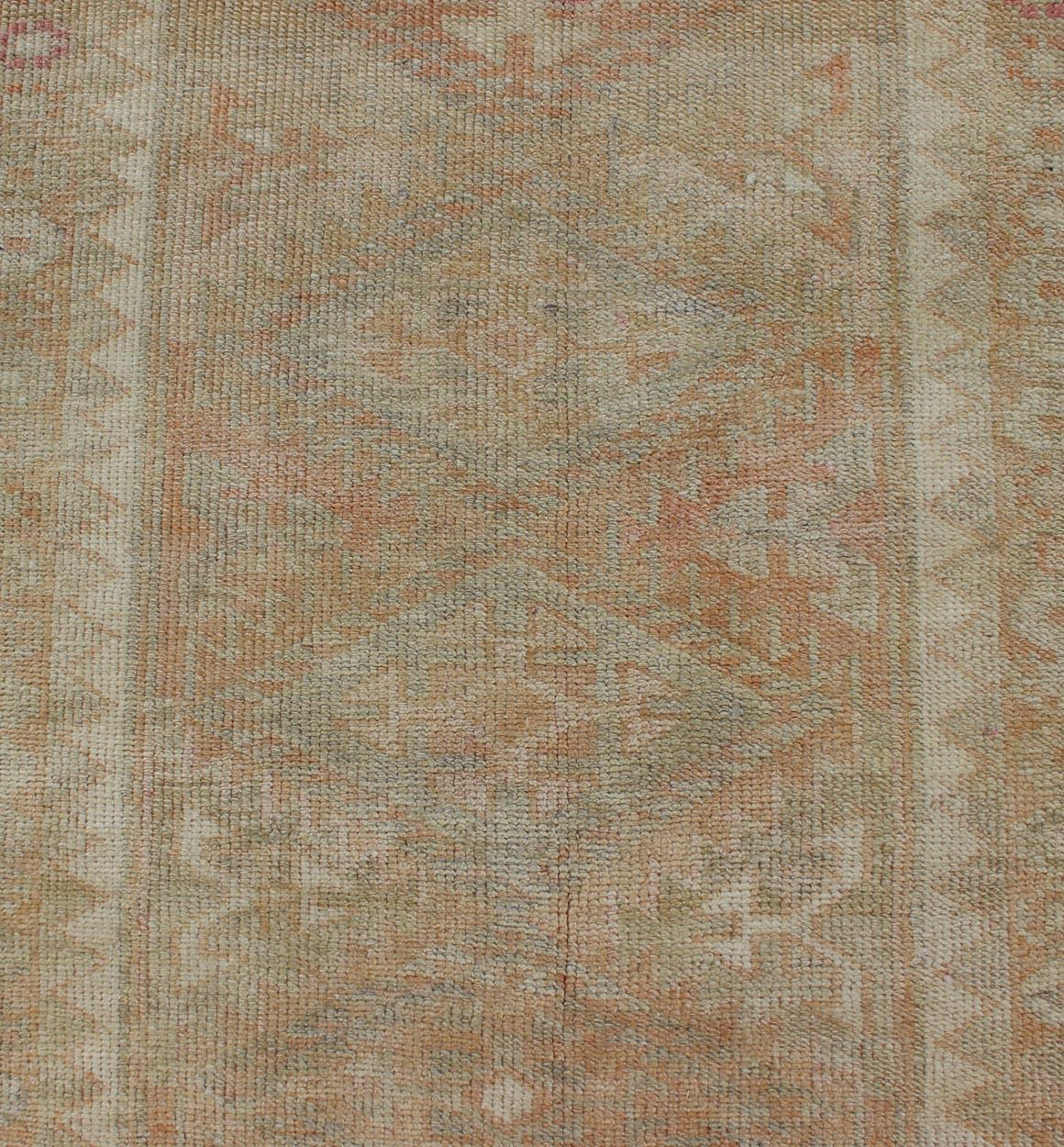Wool Vintage Turkish Oushak Runner with Geometric Medallion Design in Muted Orange For Sale