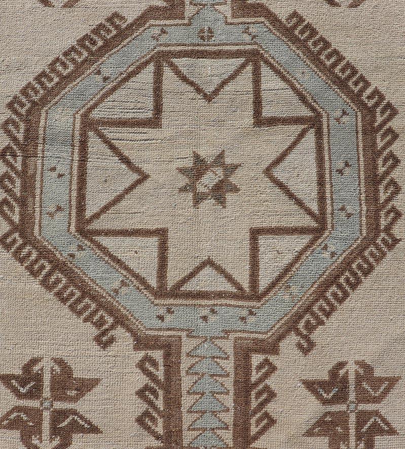 Measures: 3'1 x 9'0 
Vintage Turkish Oushak Runner with Geometric Medallions in Neutral Earth Colors. Keivan Woven Arts / Rug/TU-MTU-4662, country of origin / type: Turkey / Oushak, circa mid-20th century.

This vintage Oushak carpet from mid-20th