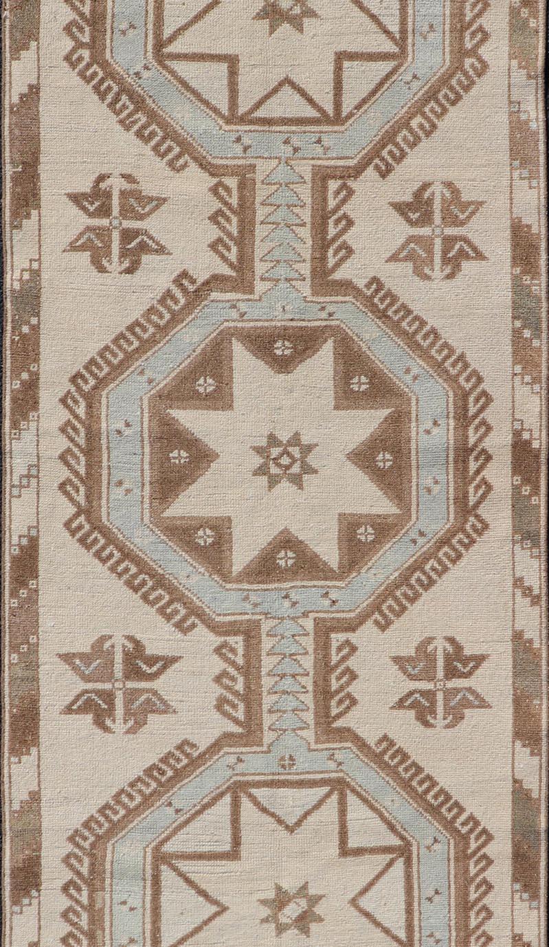 20th Century Vintage Turkish Oushak Runner with Geometric Medallions in Neutral Earth Colors For Sale