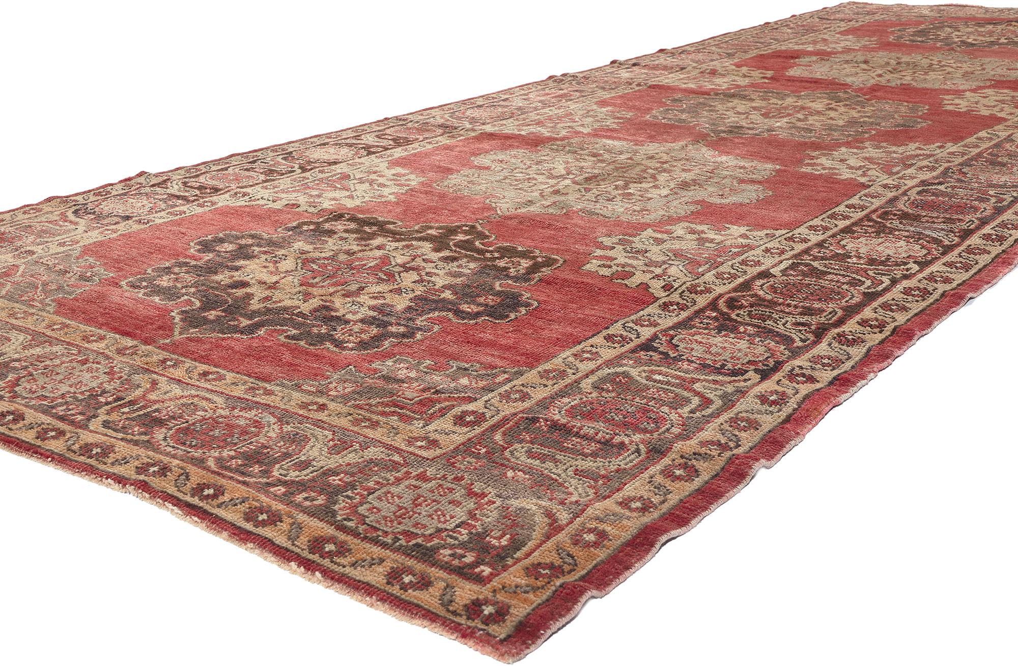52363 Vintage Turkish Oushak Rug, 05’02 x 13’07. Experience the epitome of refined opulence with this meticulously hand-knotted vintage Turkish Oushak rug, a masterpiece in earth-tone elegance. Crafted from durable wool, its exquisite botanical