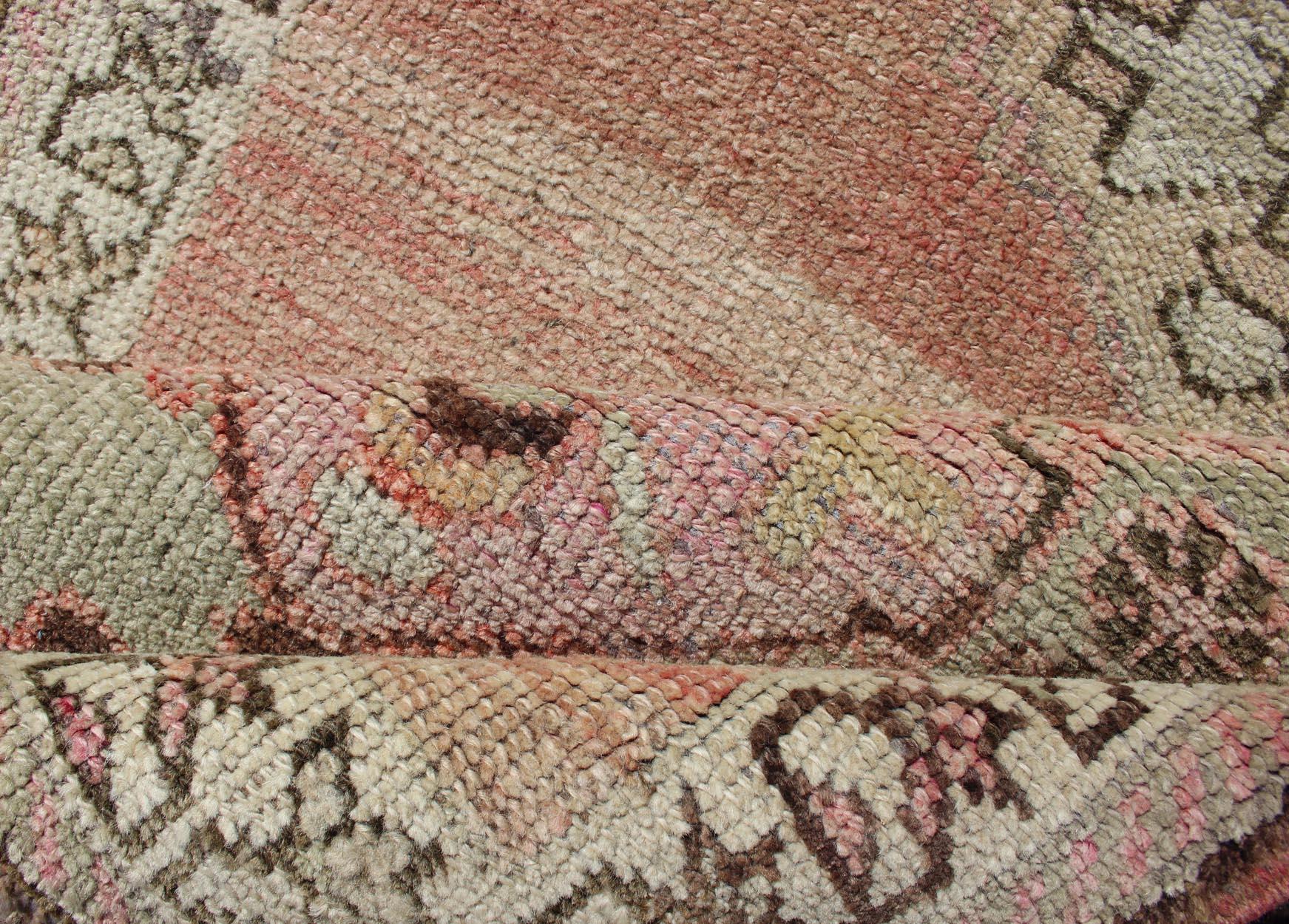 Mid-20th Century Vintage Turkish Oushak Runner with Medallion Design in Pink, Light Green & Taupe For Sale