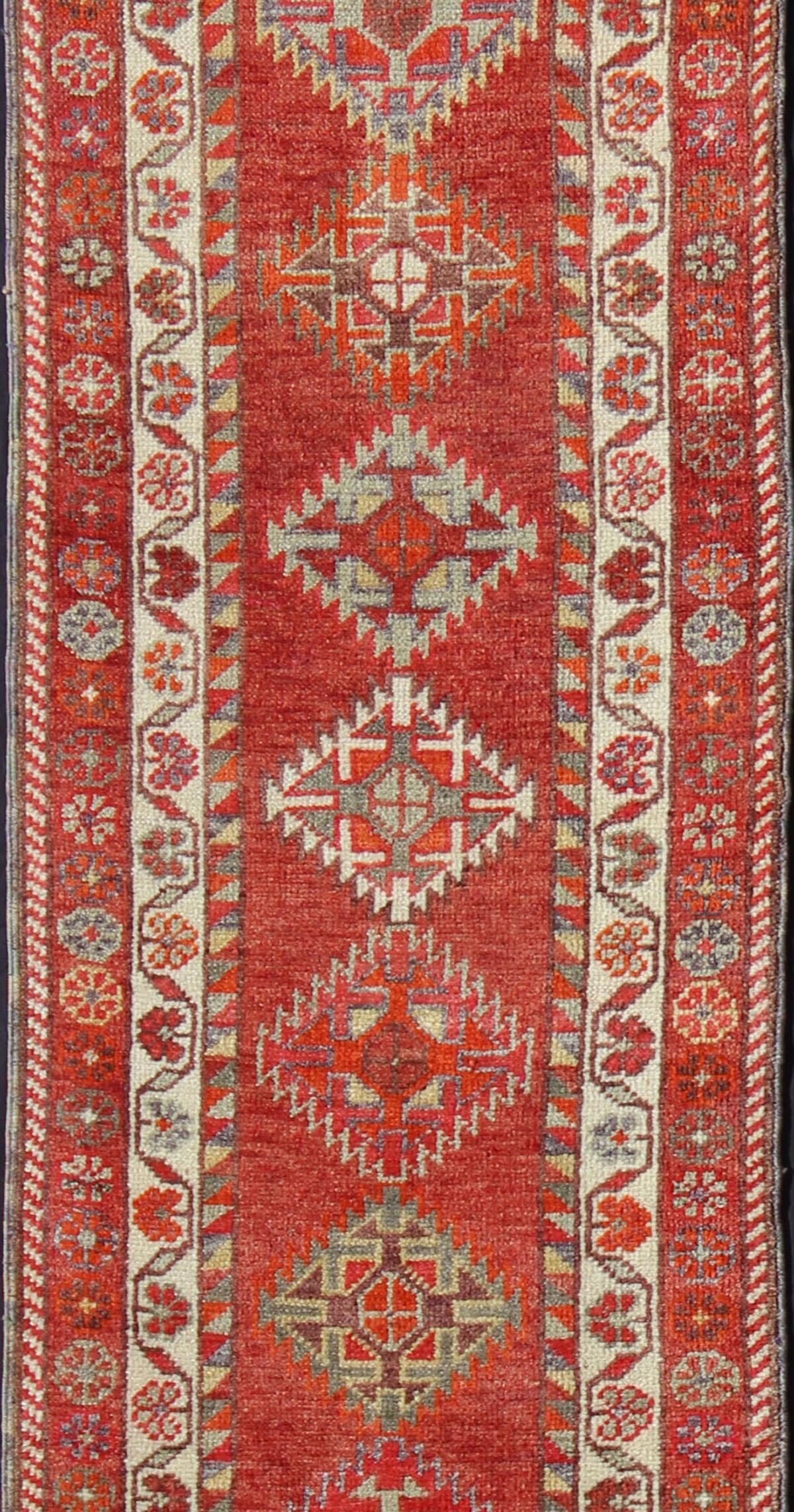 Vintage Turkish Oushak Runner with Medallions in Rust Red and Multi Colors In Good Condition For Sale In Atlanta, GA