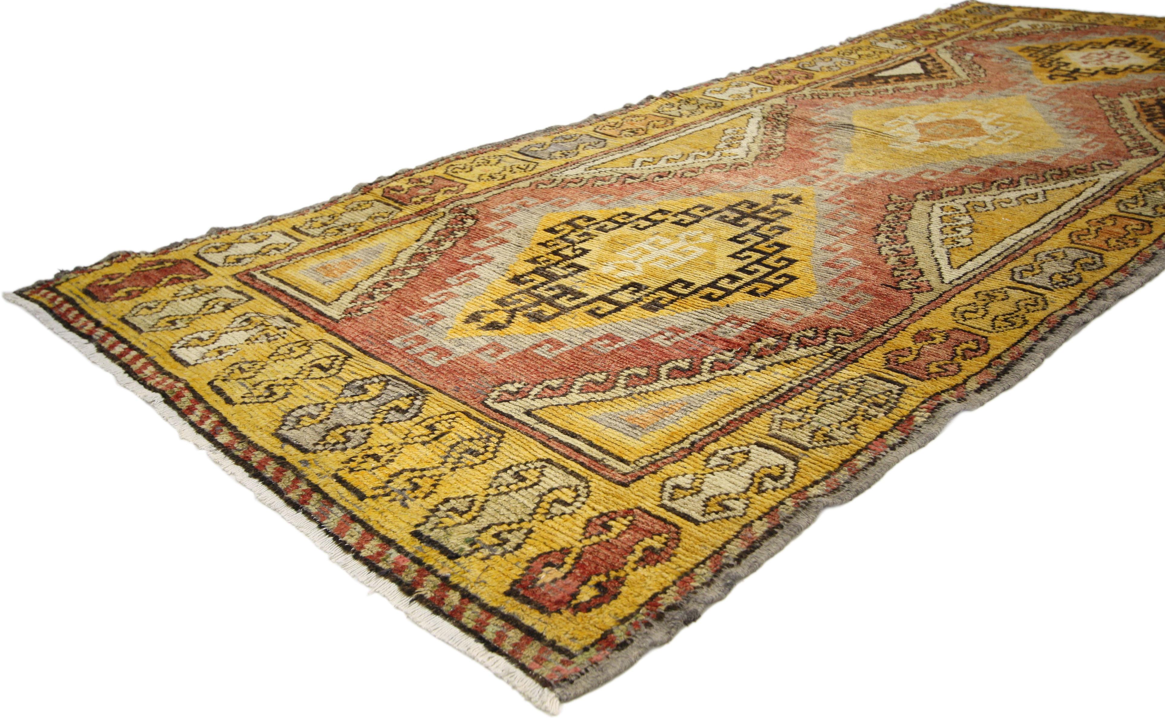 50238, vintage Turkish Oushak runner with Mid-Century Modern tribal style, hallway runner. This hand knotted wool vintage Turkish Oushak runner features three stacked lozenge medallions with latch hook edges and steep latch hooked ziggurats