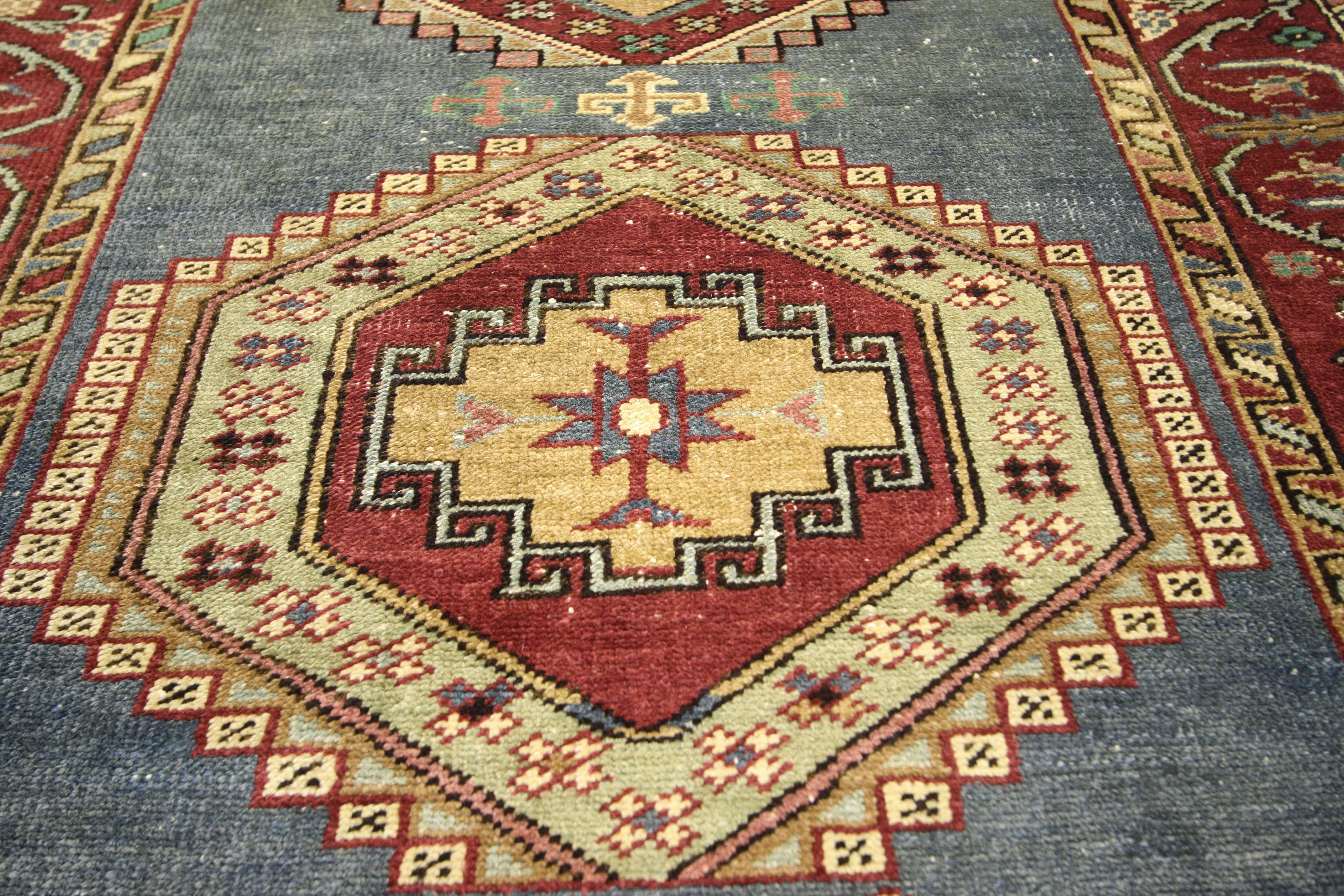 73665 Vintage Turkish Oushak Runner, Hallway Runner 03'03 x 10'11. Full of character and stately presence, this vintage Turkish Oushak carpet runner features a stacked medallion in an abrashed field surrounded by a vine scroll border. Rendered in a