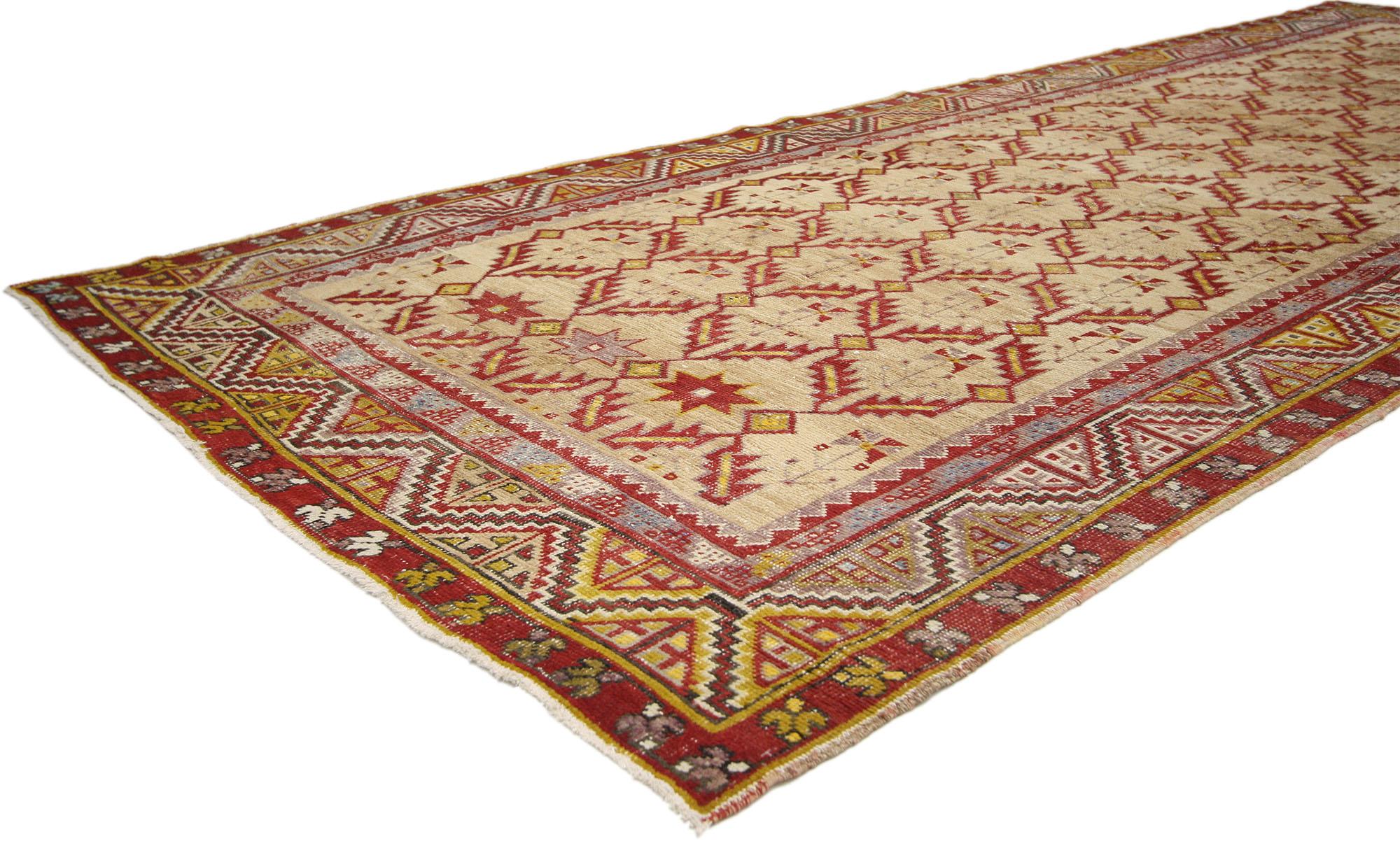 73773 vintage Turkish Oushak Runner with Modern Tribal style 04'09 X 12'06. Full of tiny details and a bold expressive design combined with exuberant colors and tribal style, this hand-knotted wool distressed vintage Turkish Oushak runner features