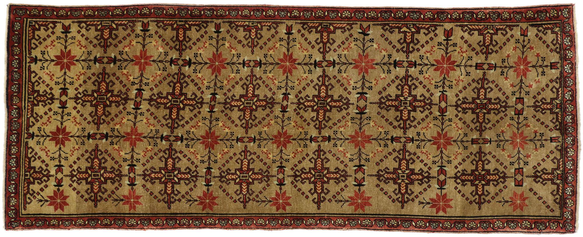 50458, vintage Turkish Oushak runner with modern tribal style, hallway runner. This hand-knotted wool vintage Turkish Oushak runner features an allover pattern with hooked crosses and poinsettia-like blossoms on a variegated camel and ecru colored